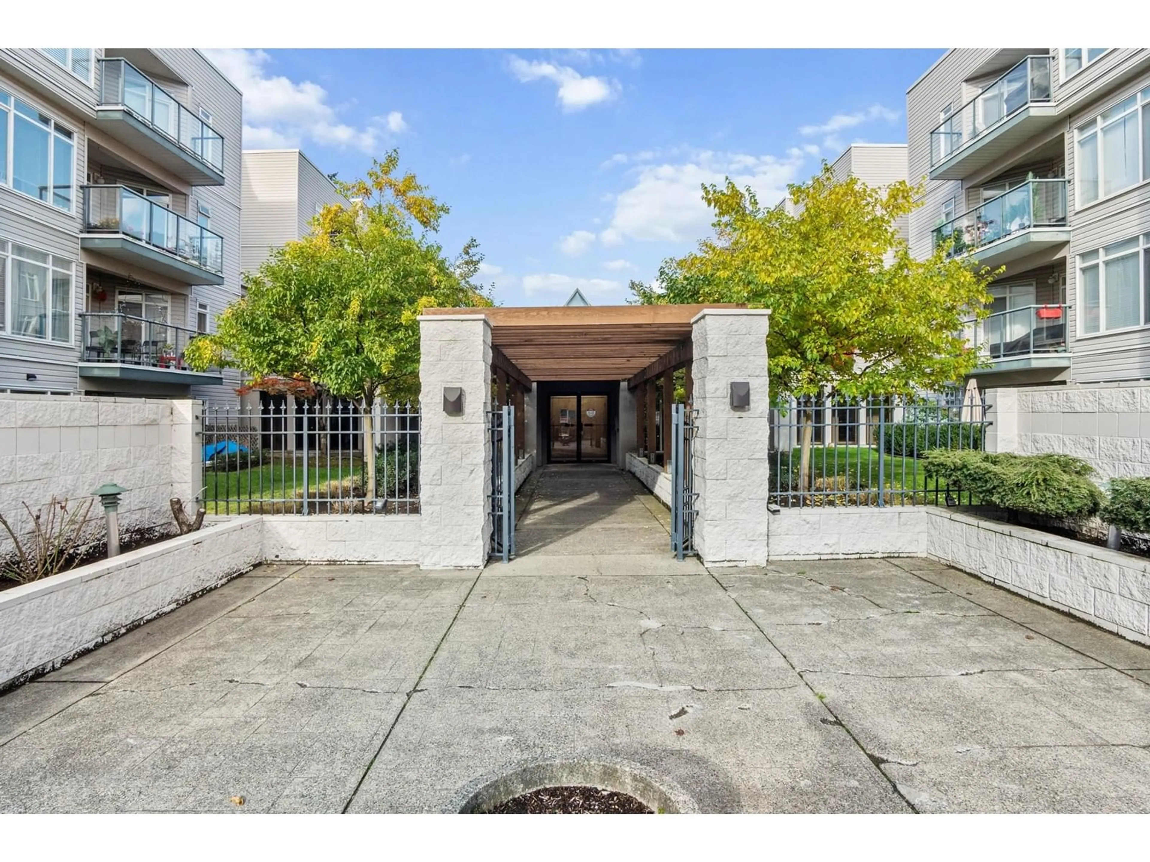 A pic from exterior of the house or condo, the street view for 208 32075 GEORGE FERGUSON WAY, Abbotsford British Columbia V2T2K7