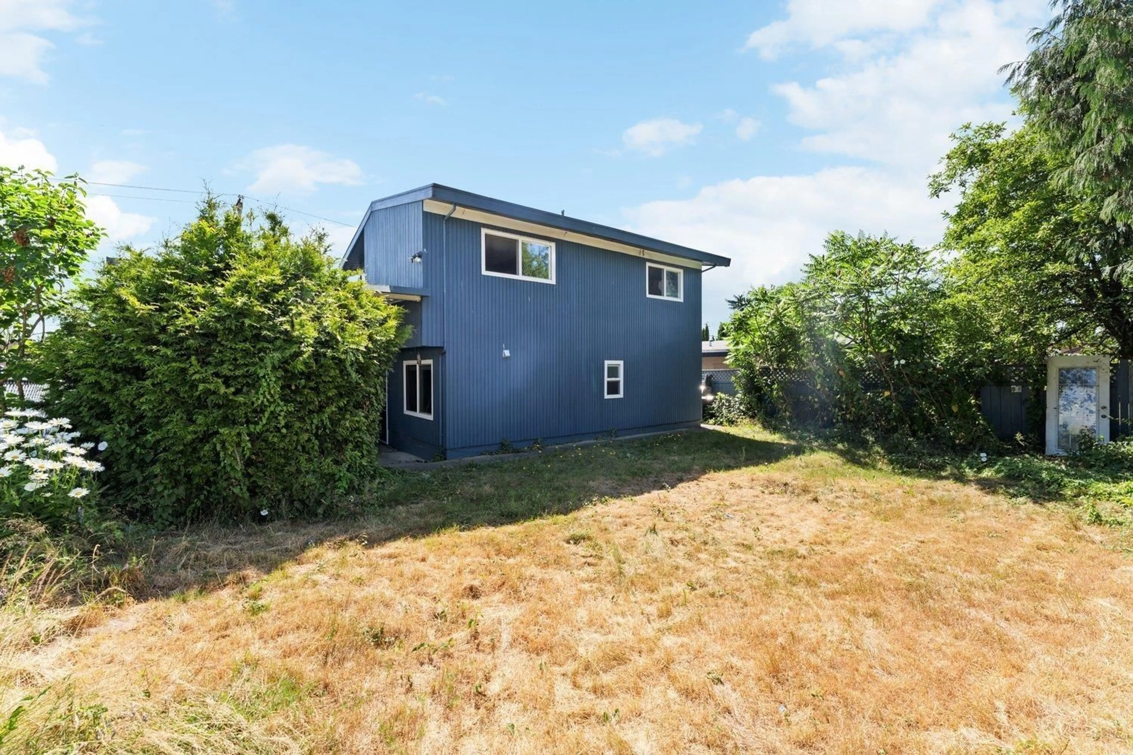 Frontside or backside of a home, the fenced backyard for 7119 NICHOLSON ROAD, Delta British Columbia V4E1Z9