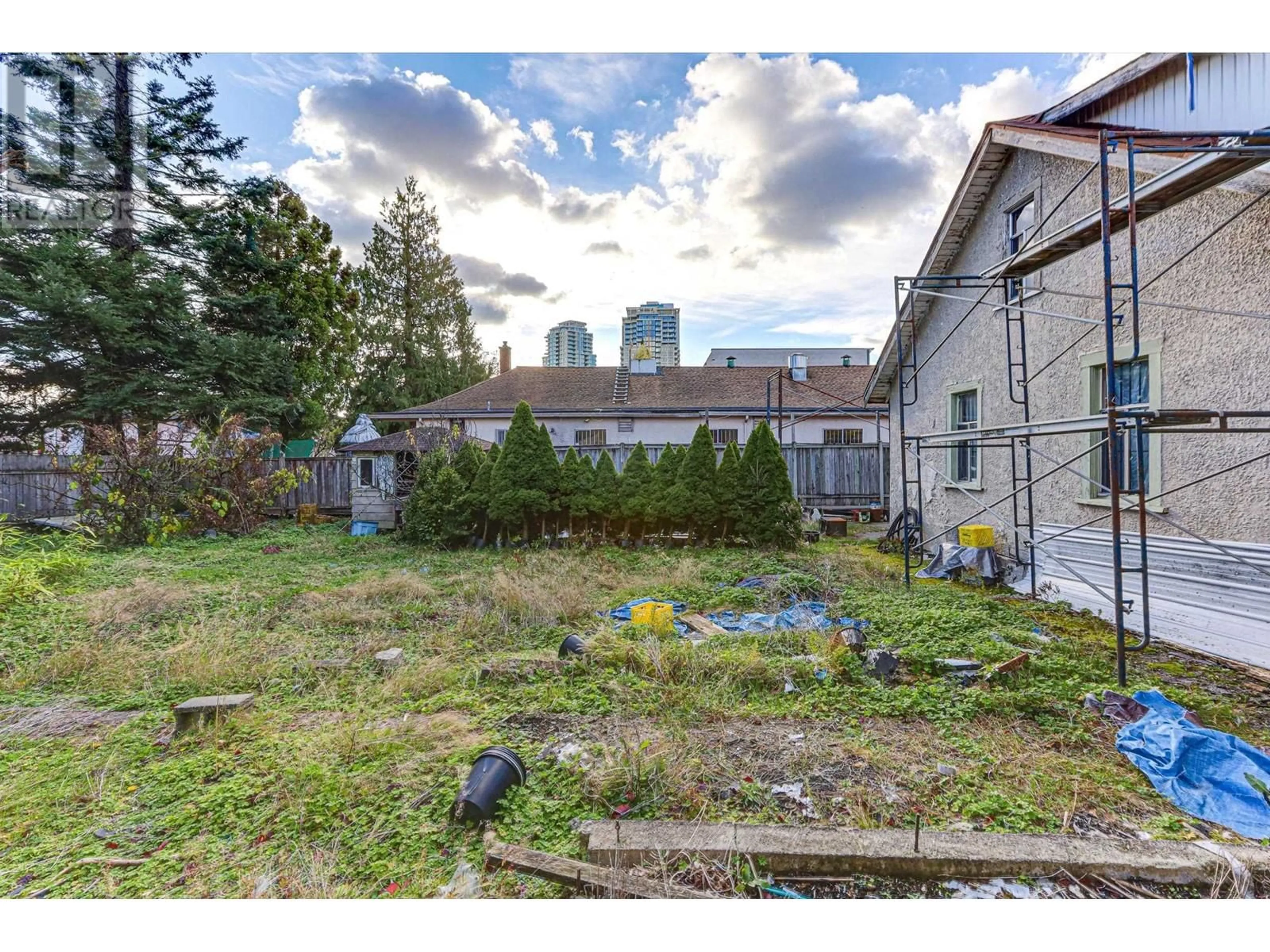 Frontside or backside of a home, the fenced backyard for 7474 EDMONDS STREET, Burnaby British Columbia V3N1B2