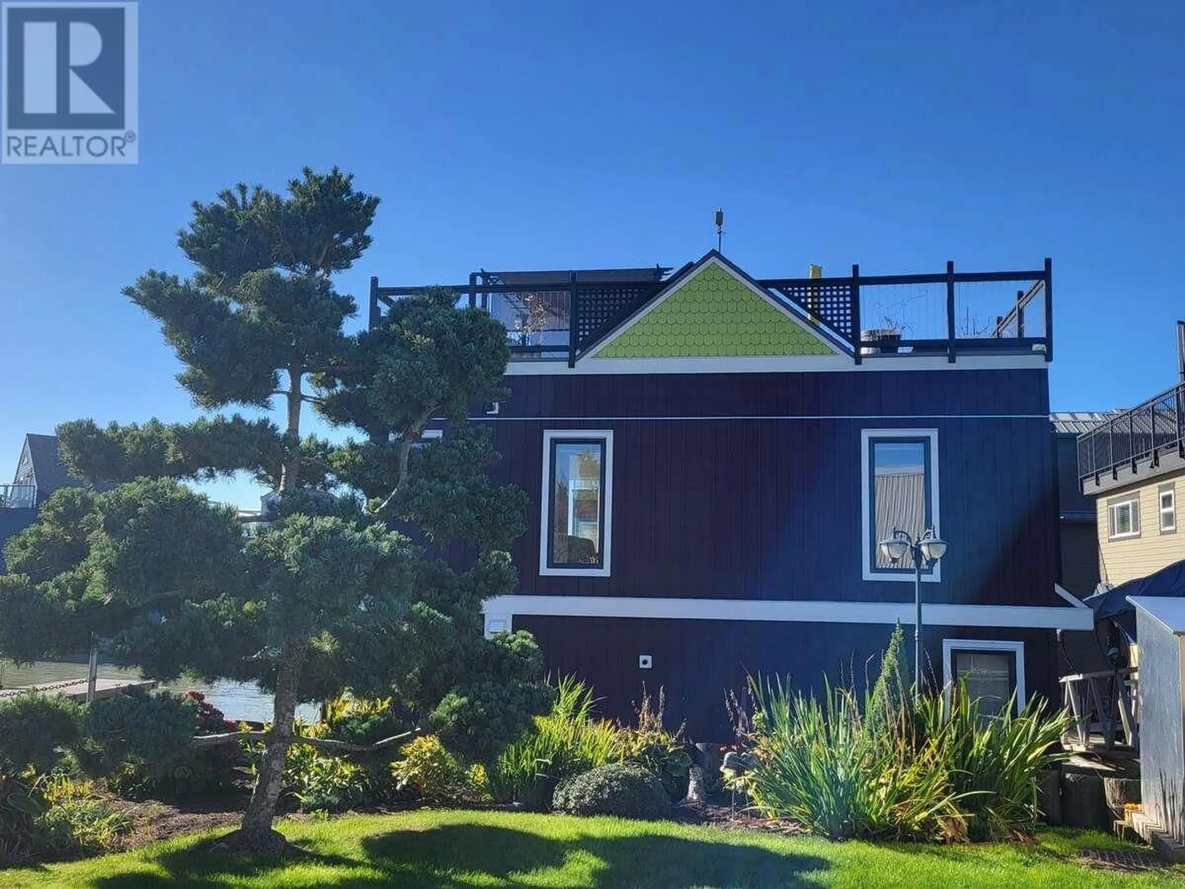A pic from outside/outdoor area/front of a property/back of a property/a pic from drone, water/lake/river/ocean view for 1 - 3473 RIVER ROAD, Delta British Columbia V4K5E9