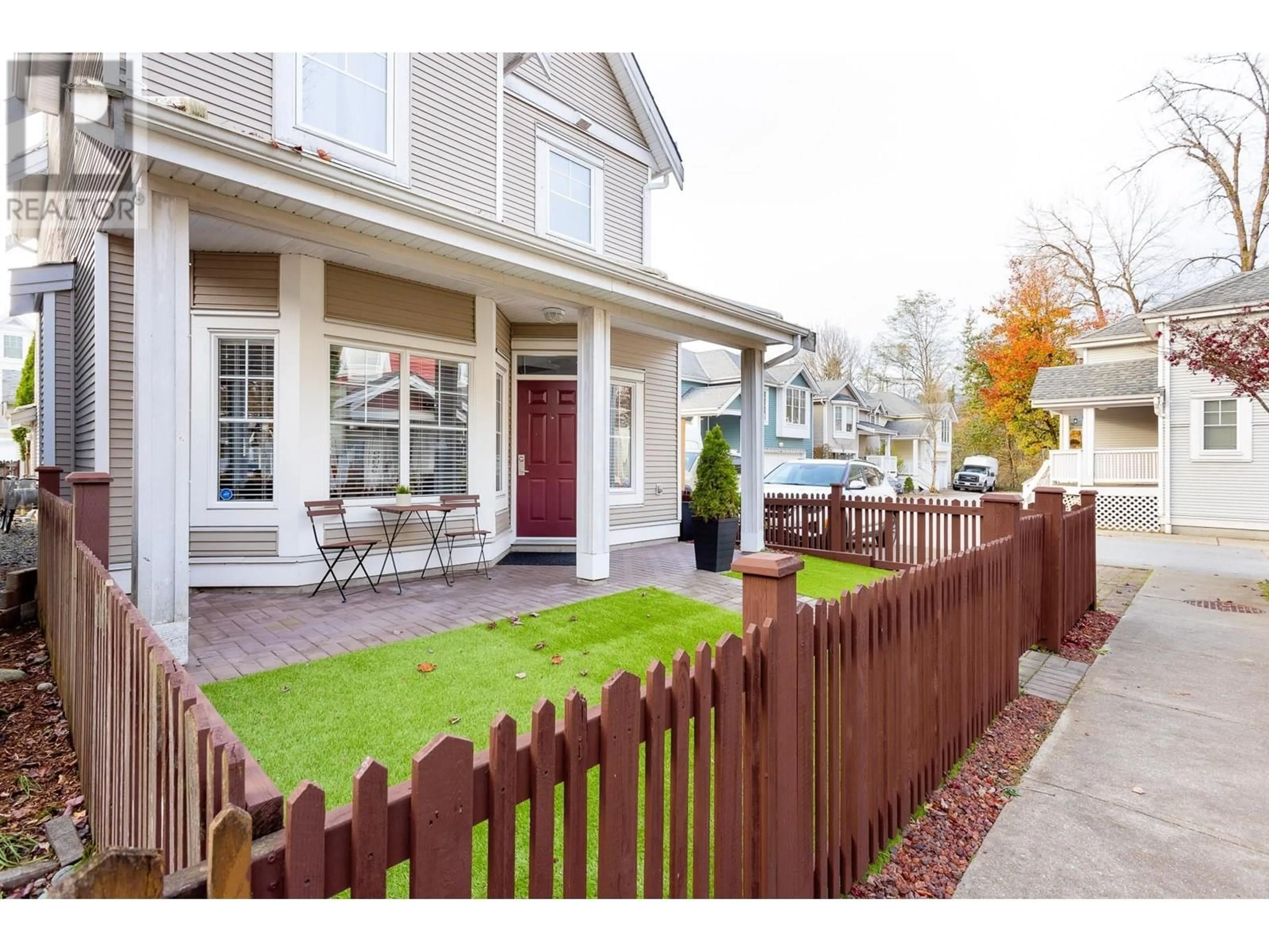 Frontside or backside of a home, the fenced backyard for 210 3000 RIVERBEND DRIVE, Coquitlam British Columbia V3C6R1