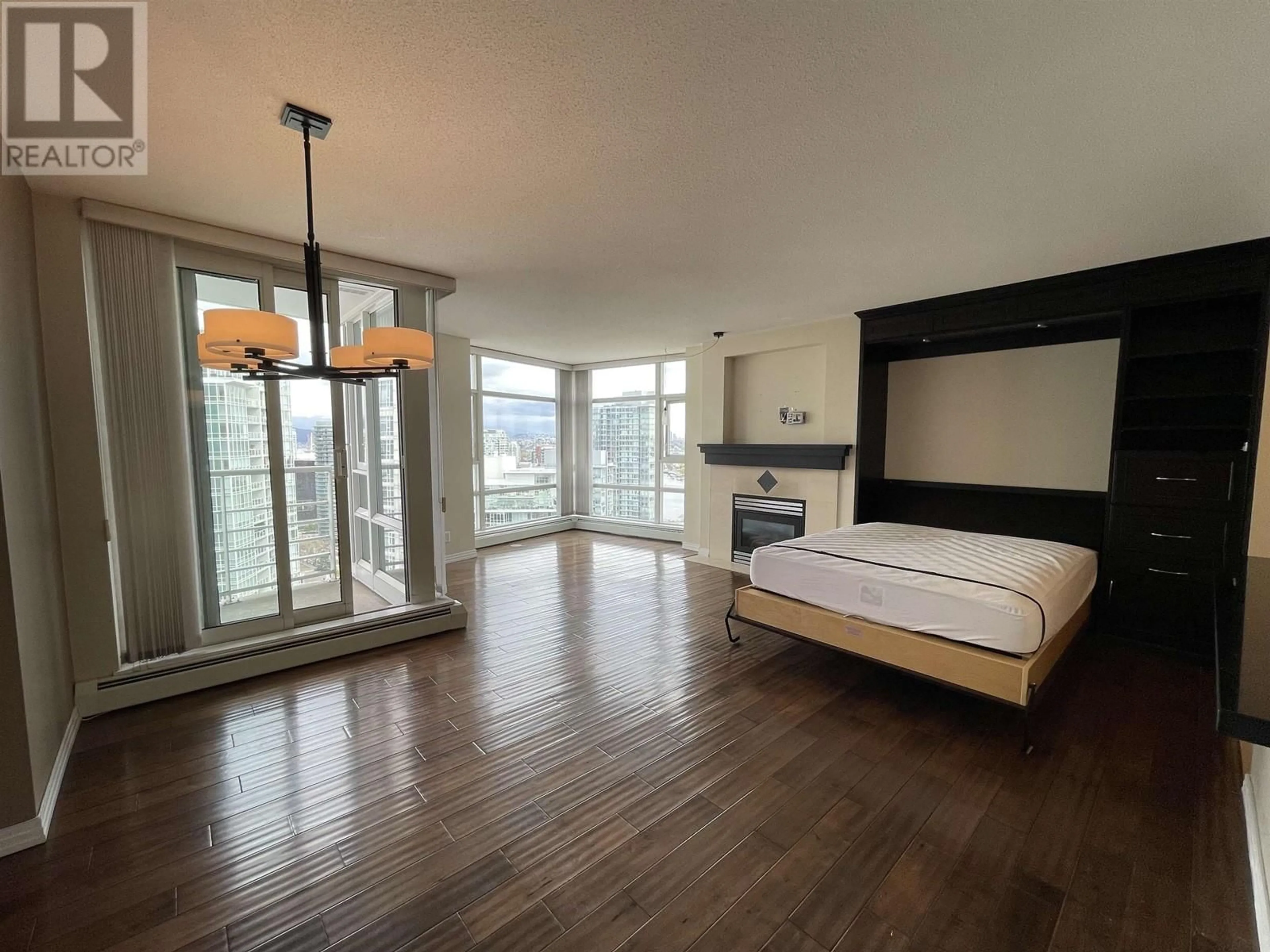 A pic of a room, wood floors for 3203 1199 MARINASIDE CRESCENT, Vancouver British Columbia V6Z2Y2