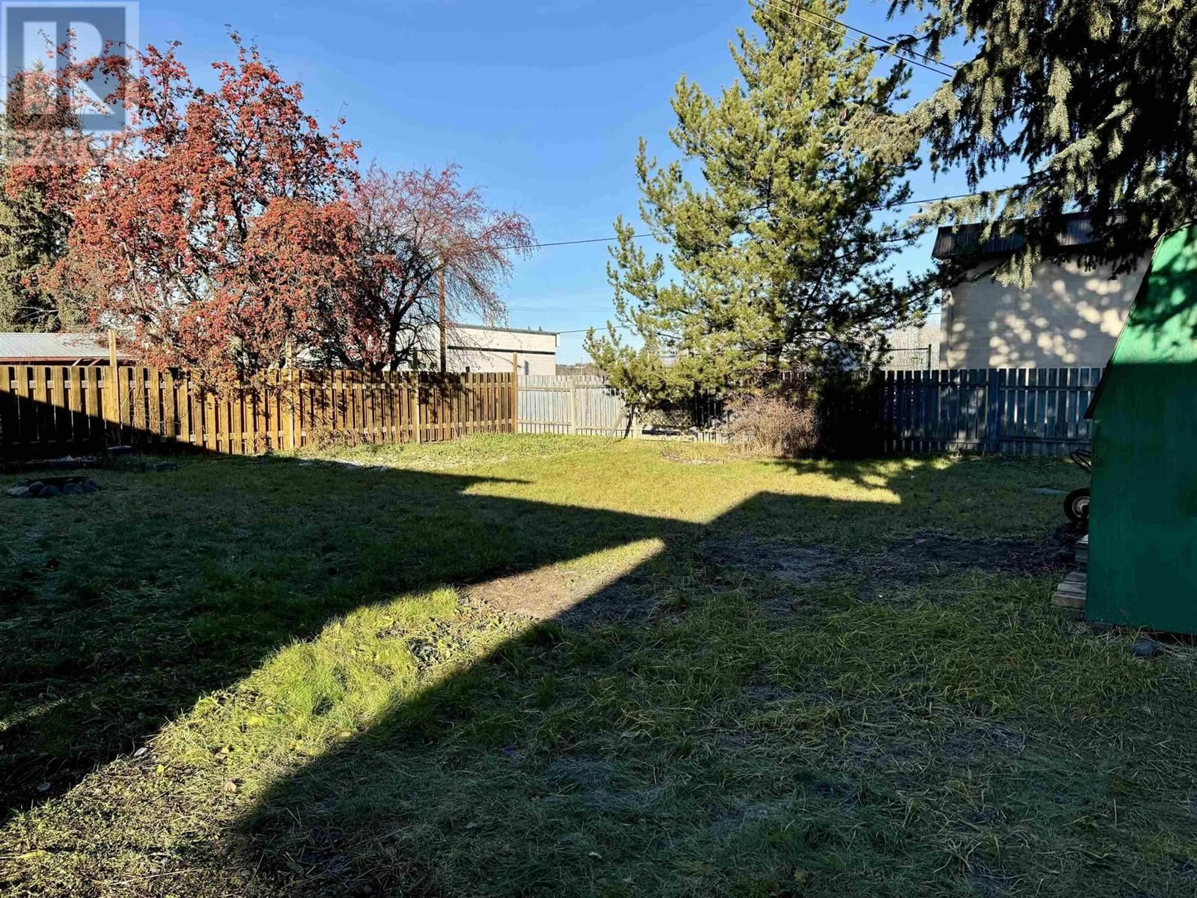 Frontside or backside of a home, the fenced backyard for 377 W 2ND STREET, Vanderhoof British Columbia V0J3A0