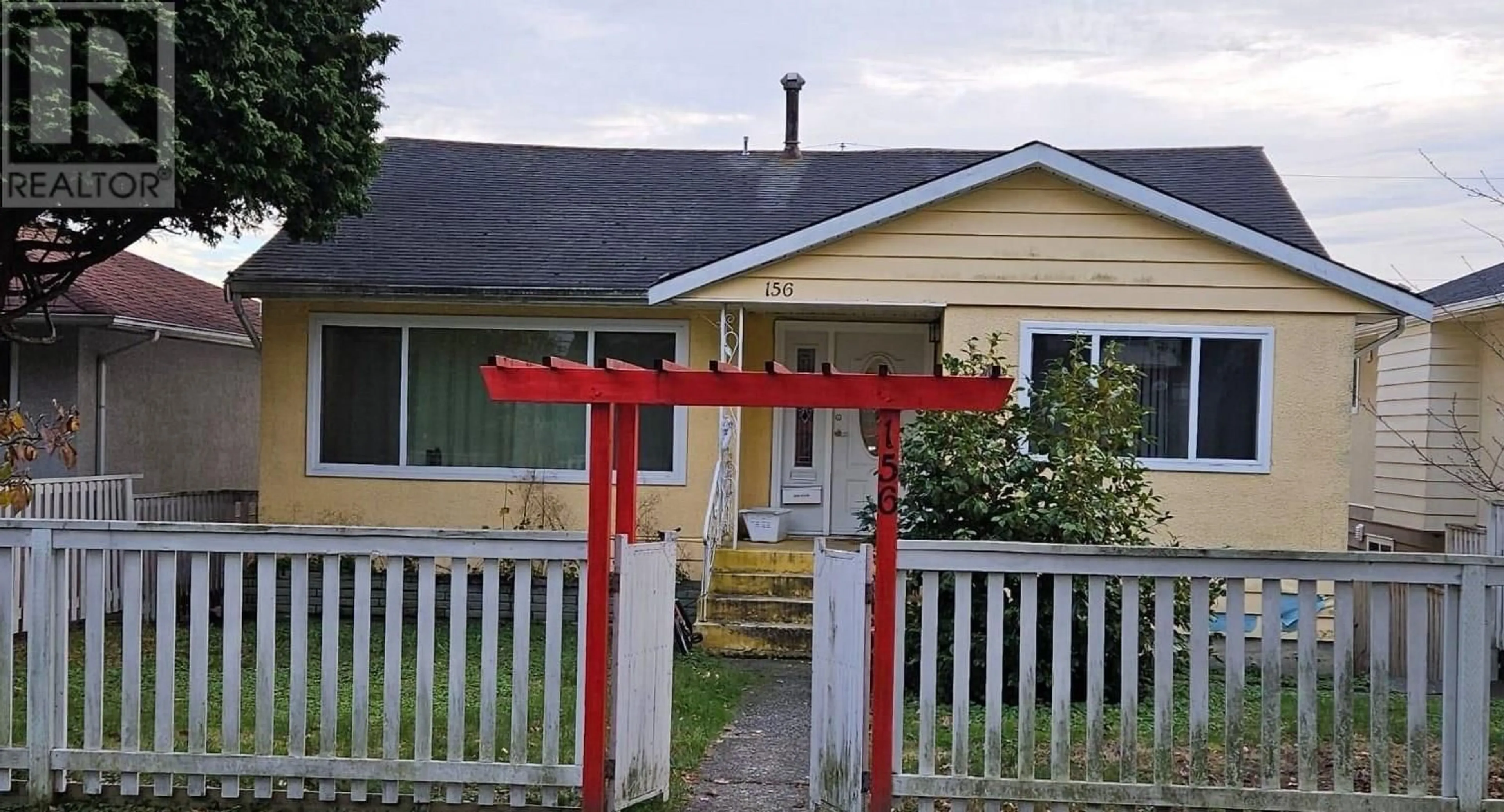 Frontside or backside of a home, the fenced backyard for 156 W 62ND AVENUE, Vancouver British Columbia V5X2E1