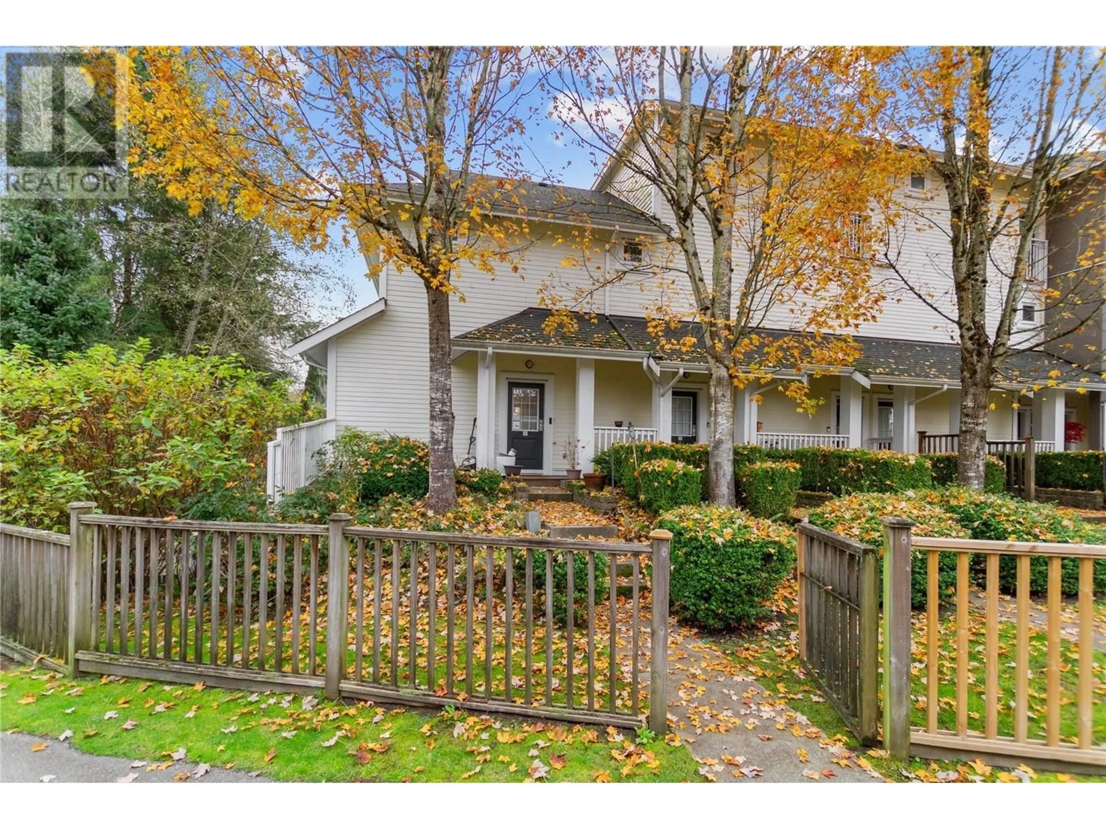 A pic from exterior of the house or condo, the fenced backyard for 10 6965 HASTINGS STREET, Burnaby British Columbia V5B1S9