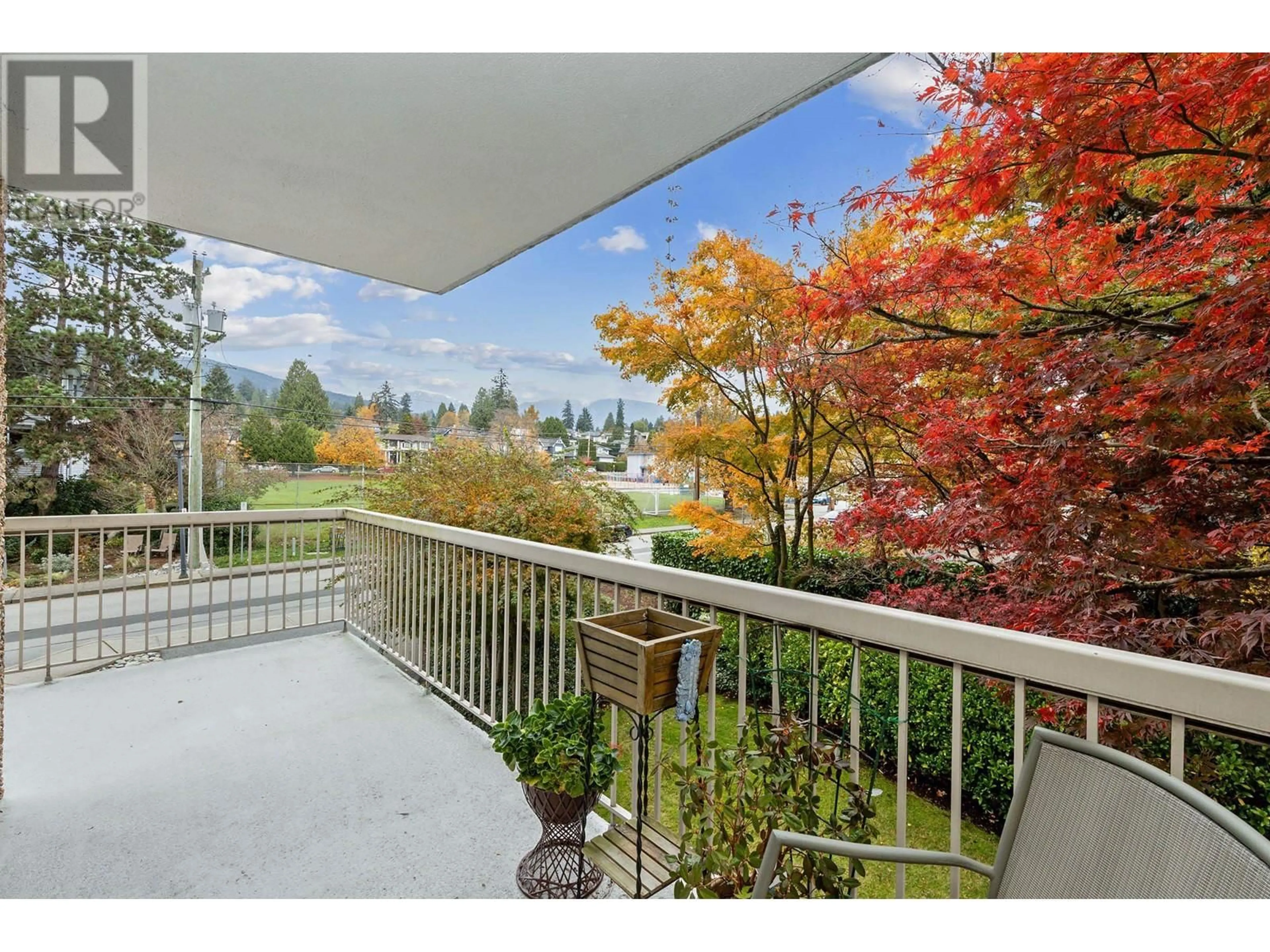 A pic from exterior of the house or condo, the fenced backyard for 203 1390 DUCHESS AVENUE, West Vancouver British Columbia V7T1H6