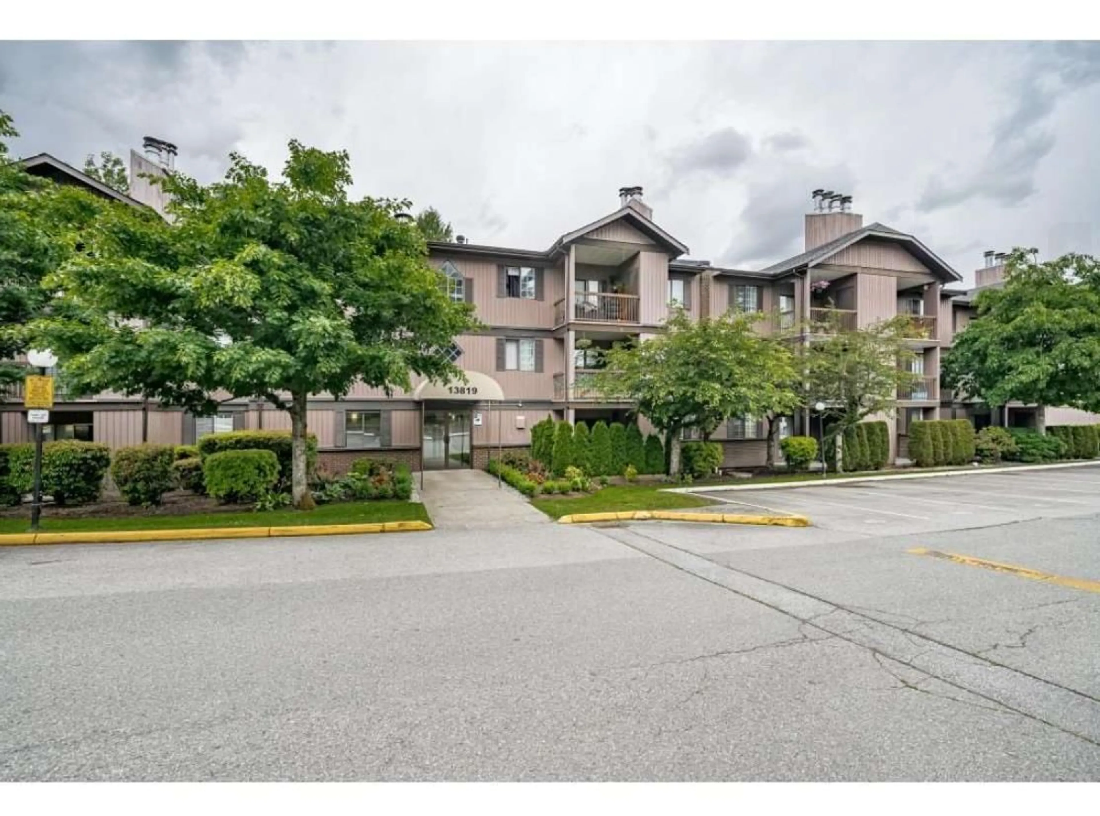 A pic from outside/outdoor area/front of a property/back of a property/a pic from drone, street for 2106 - 13819 100, Surrey British Columbia V3T5L1