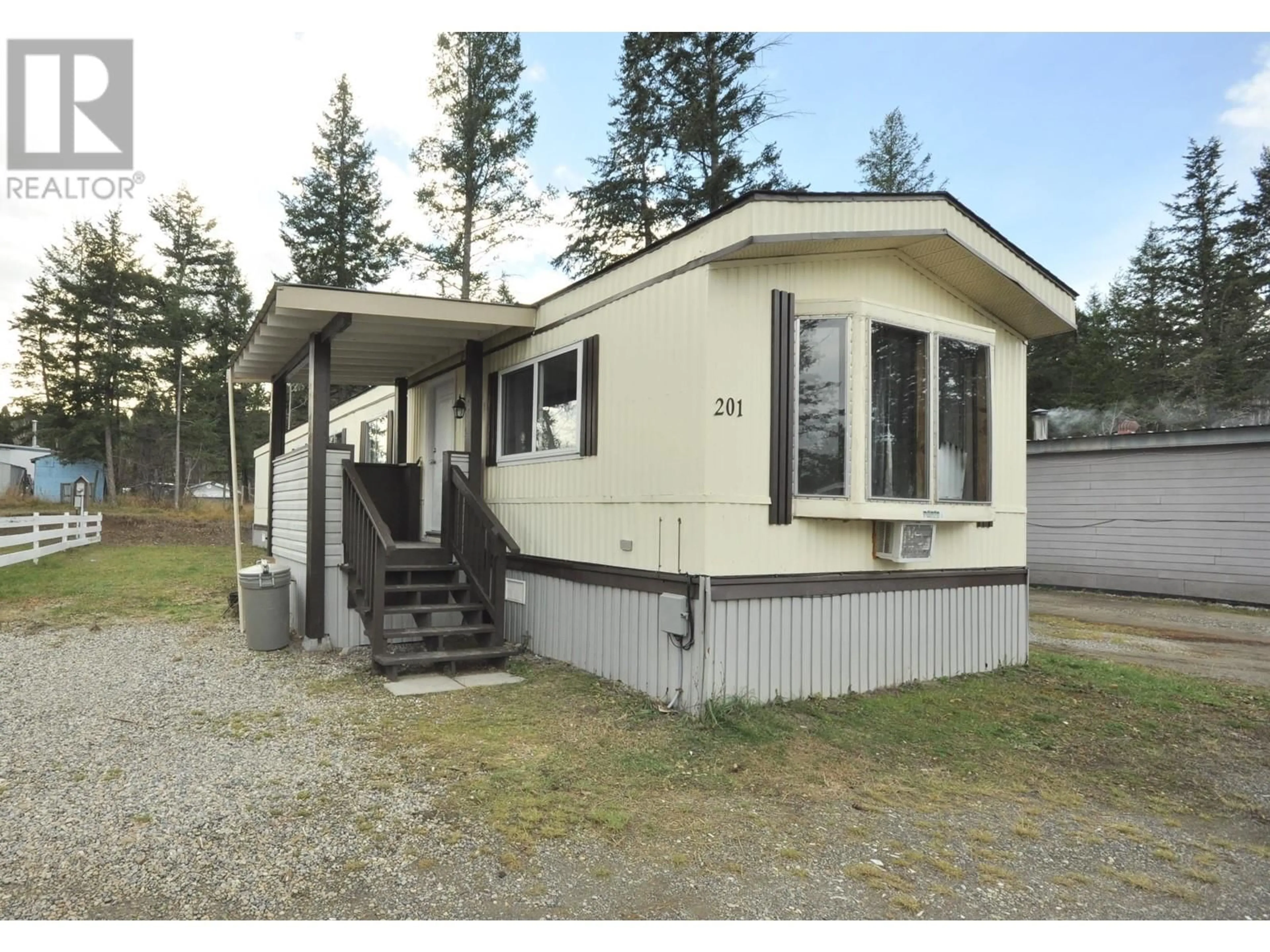 Home with vinyl exterior material for 201 1427 DOG CREEK ROAD, Williams Lake British Columbia V2G3H3