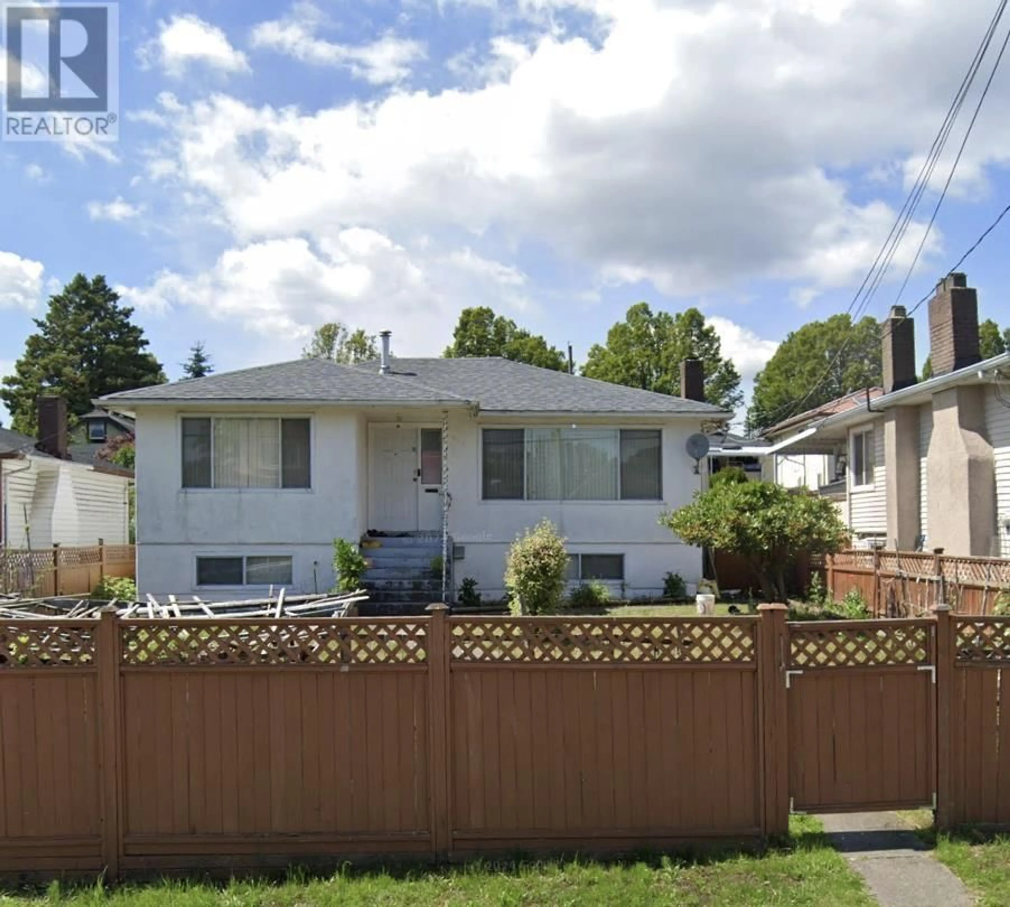 Frontside or backside of a home, the fenced backyard for 4951 RUPERT STREET, Vancouver British Columbia V5R2J6