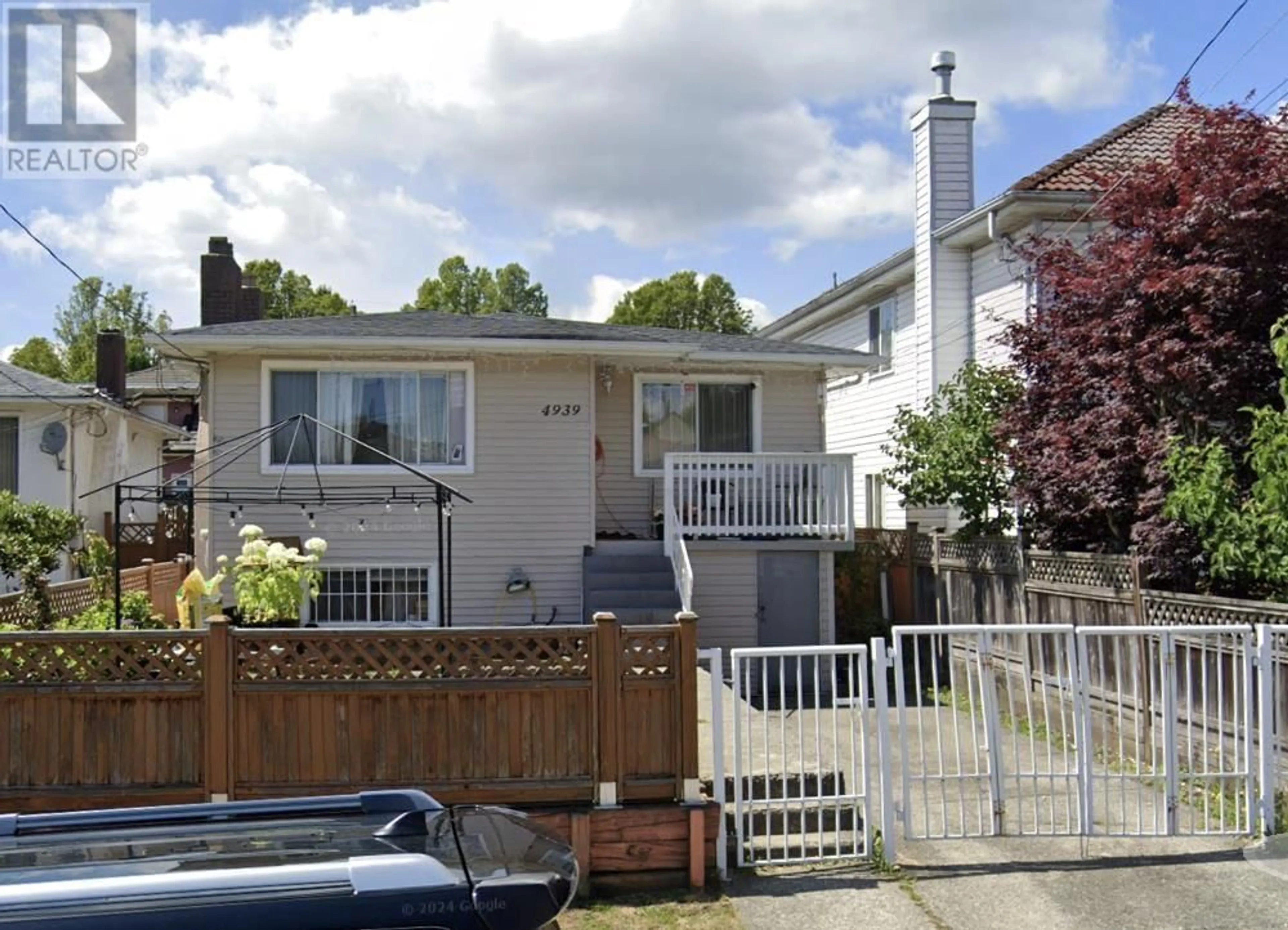 Frontside or backside of a home, the fenced backyard for 4939 RUPERT STREET, Vancouver British Columbia V5R2J6