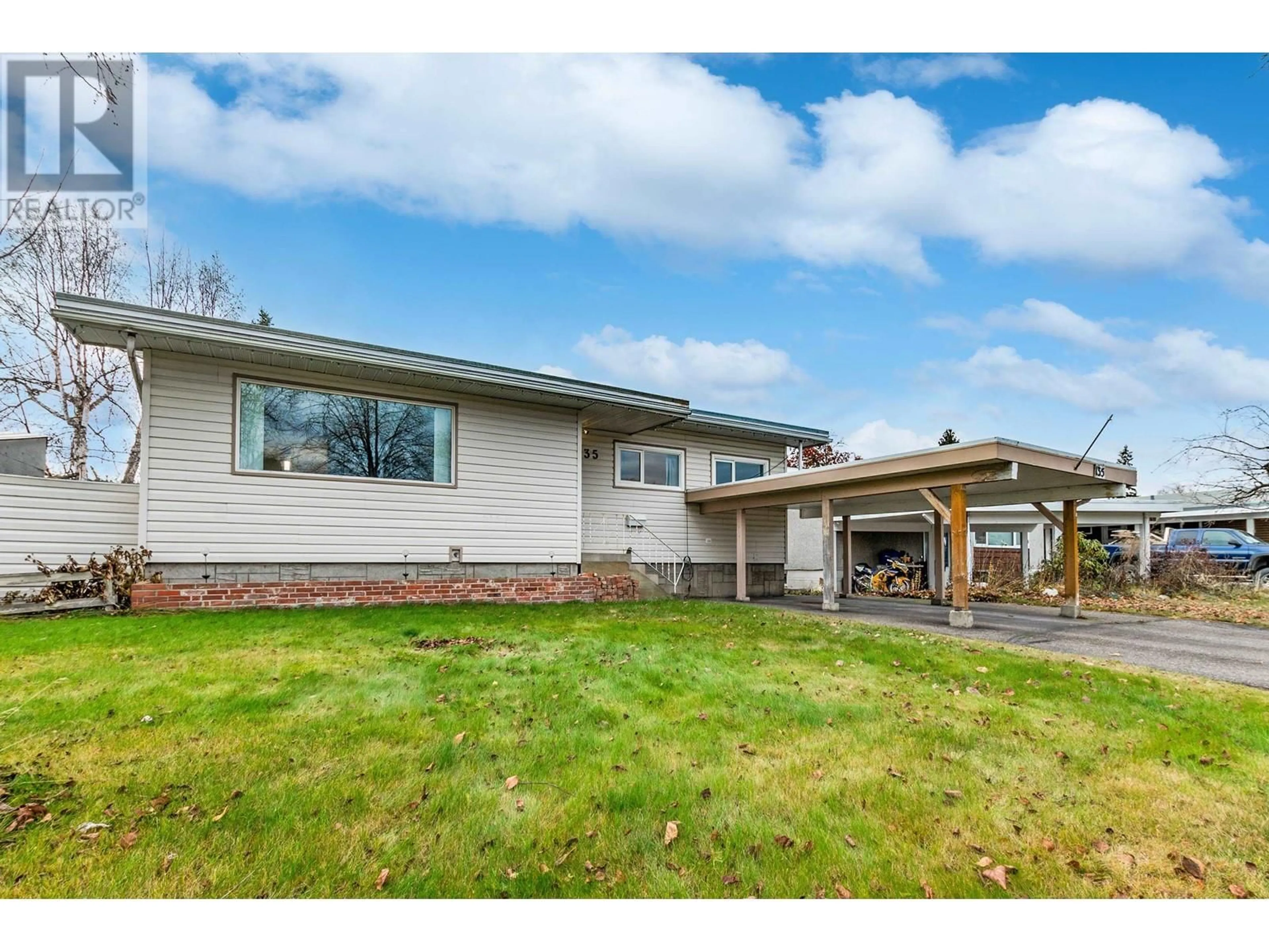 Frontside or backside of a home, the fenced backyard for 135 KELLY STREET, Prince George British Columbia V2M3E3