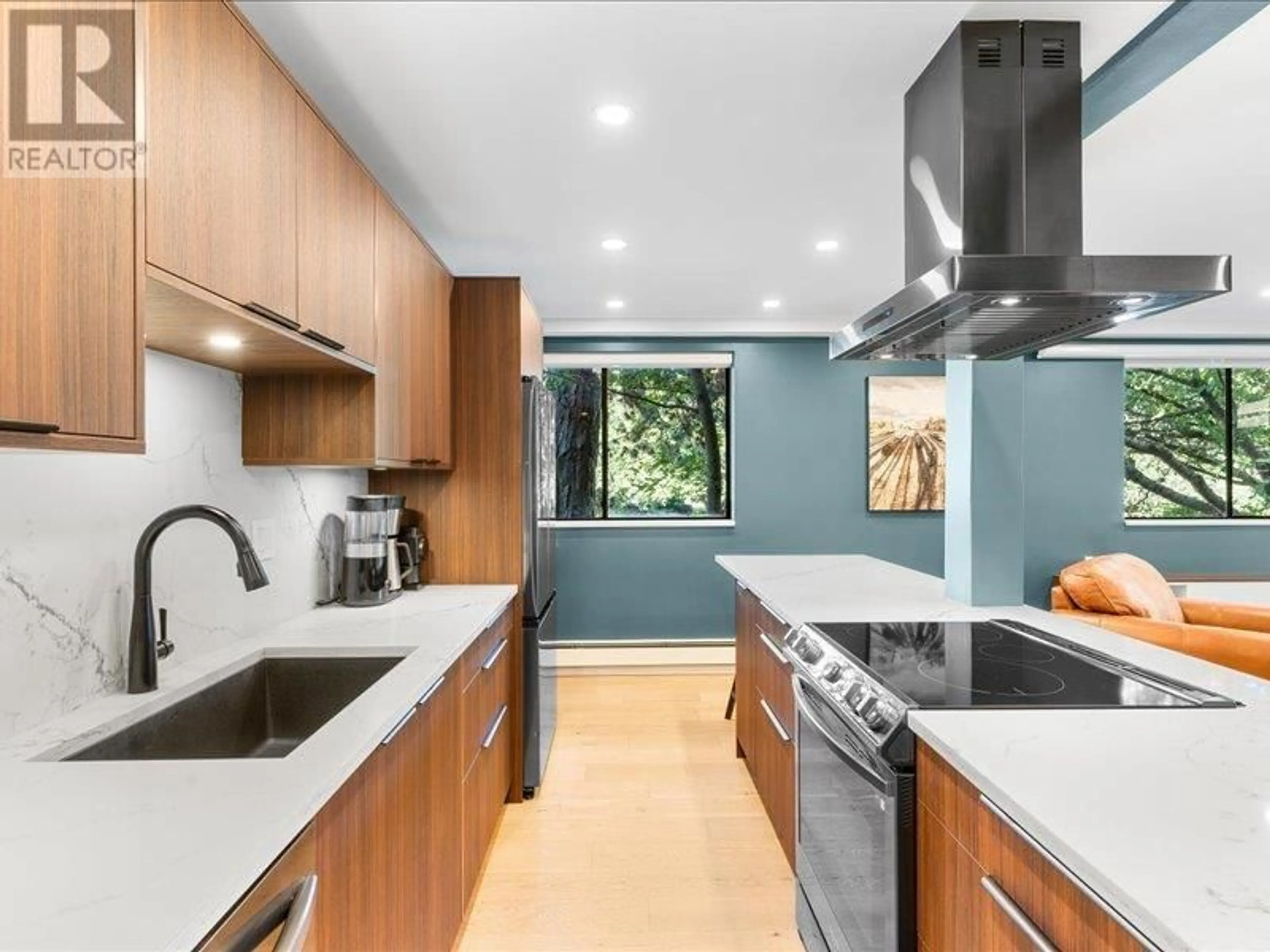 Contemporary kitchen, wood floors for 101 710 E 6TH AVENUE, Vancouver British Columbia V5T1L5