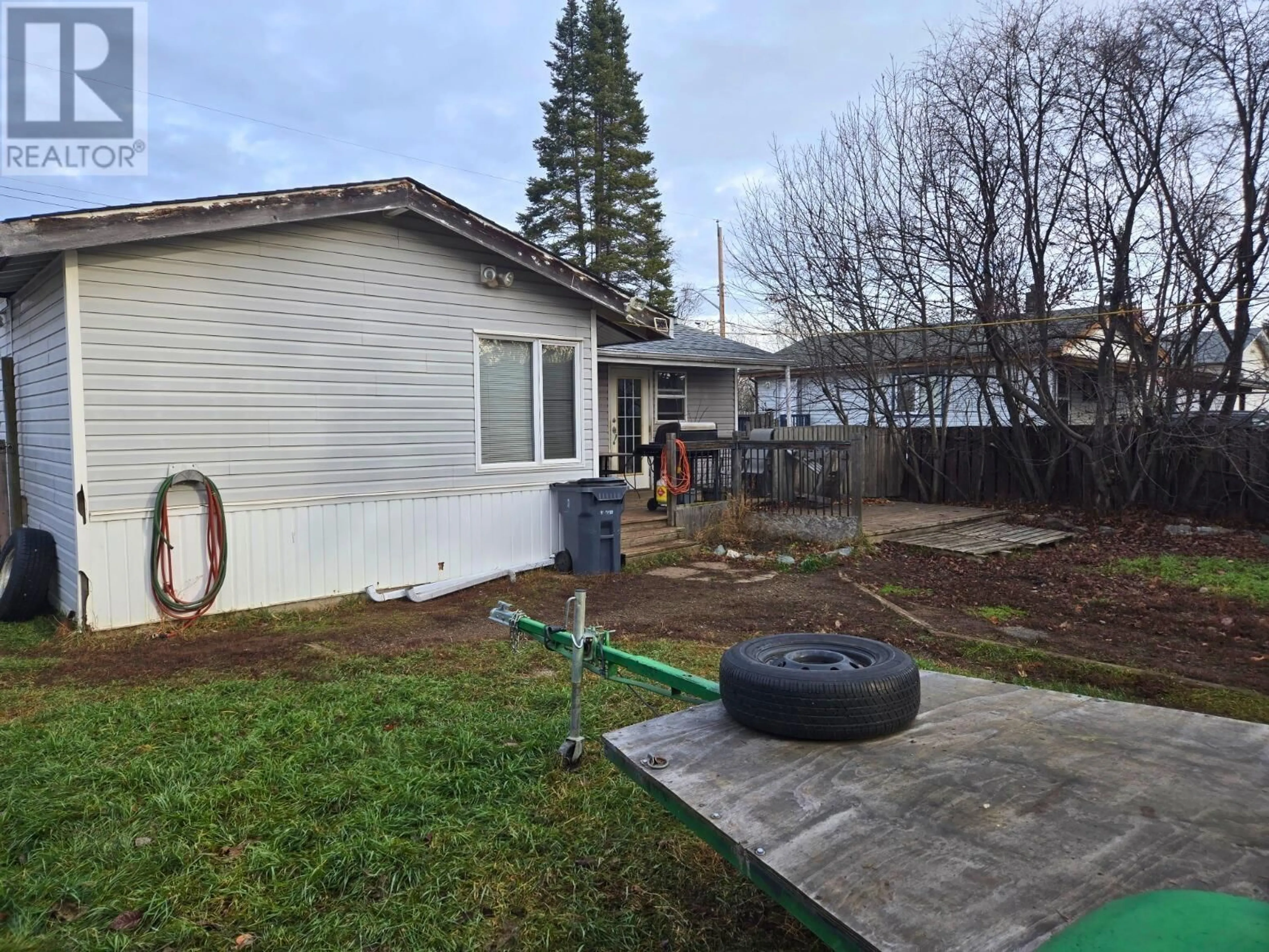 Frontside or backside of a home, the fenced backyard for 2715 MERRITT ROAD, Prince George British Columbia V2N1M5