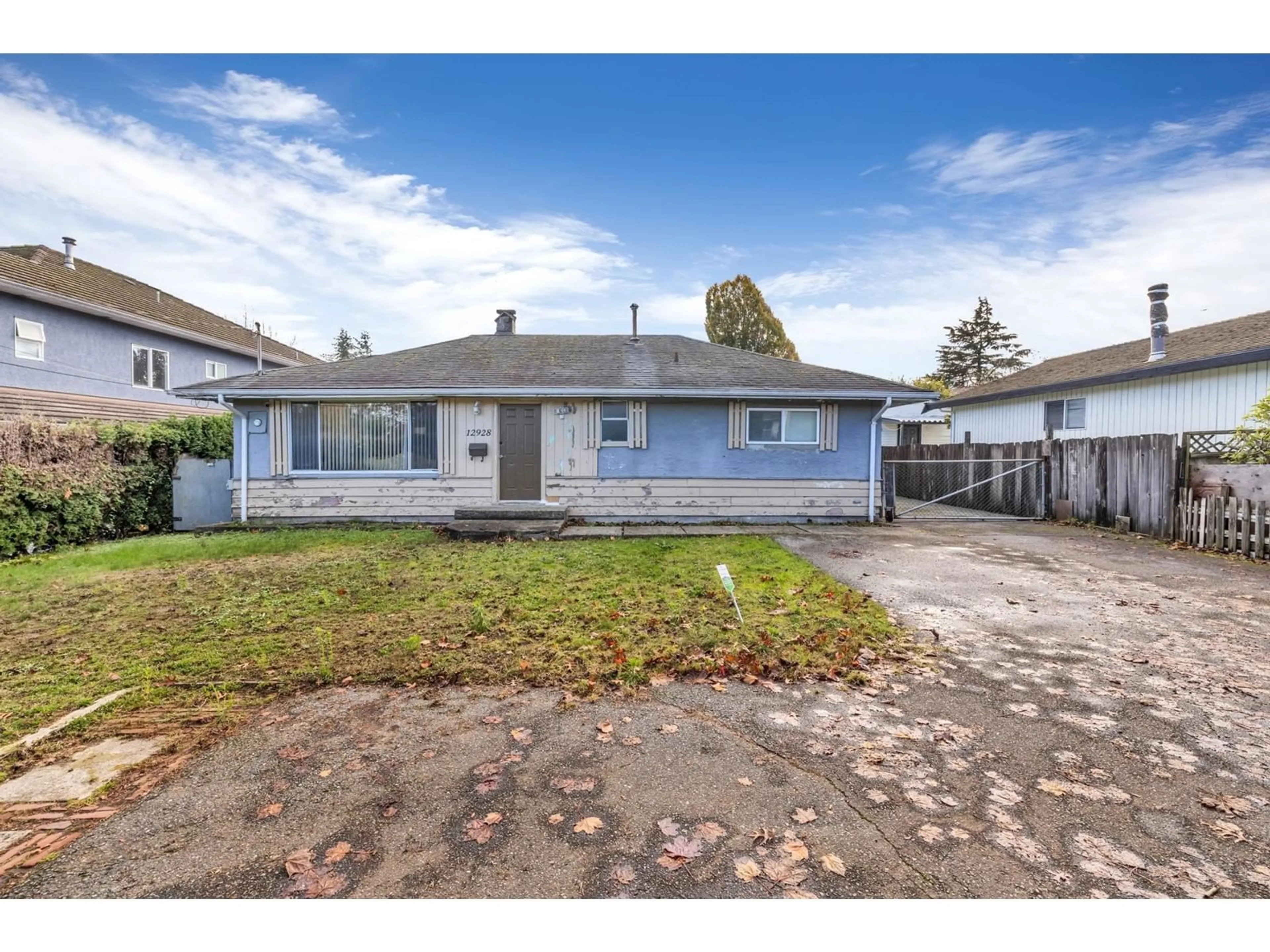 Frontside or backside of a home, the fenced backyard for 12928 64TH AVENUE, Surrey British Columbia V3W1X5