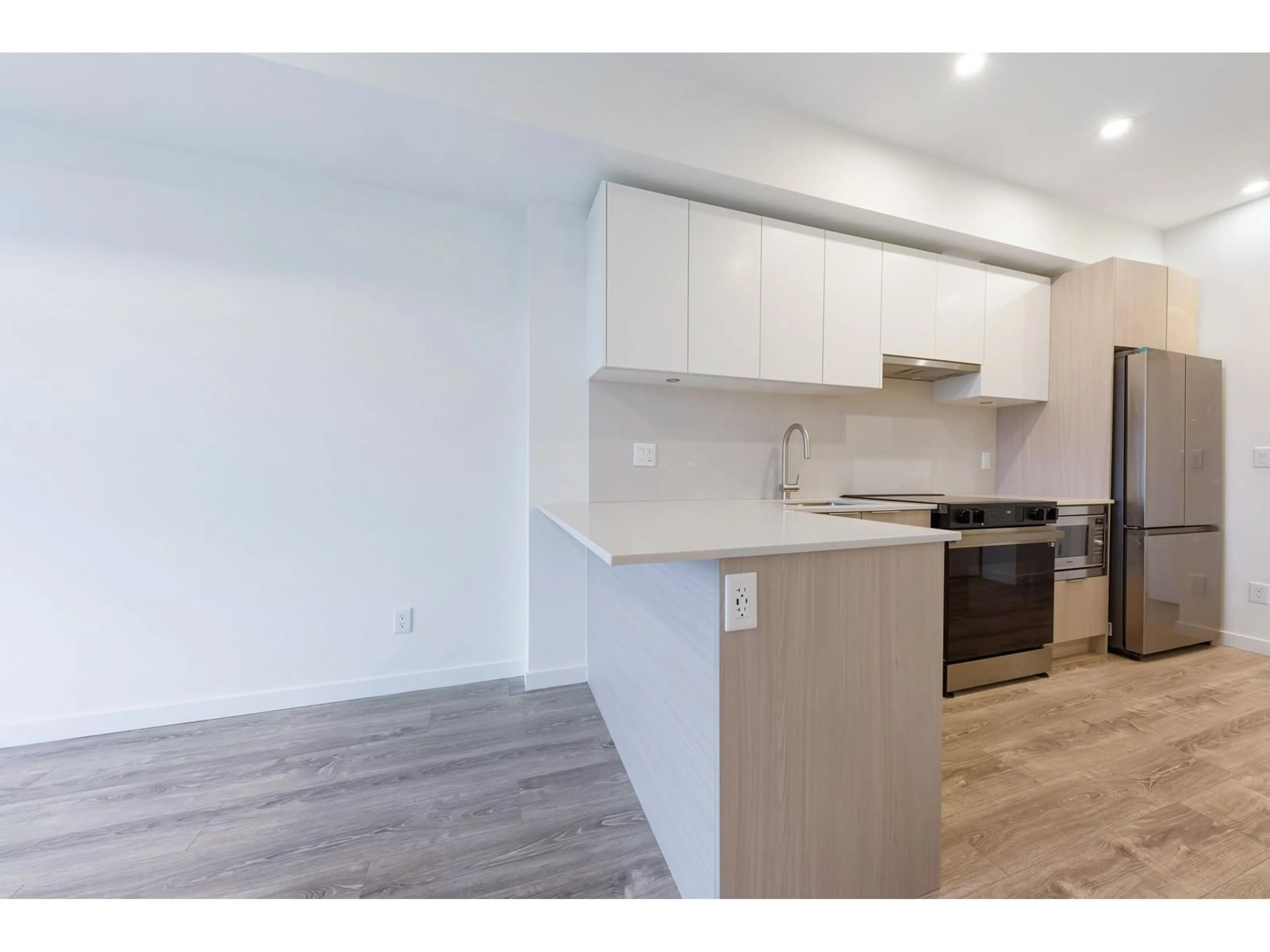 Open concept kitchen for E607 10829 E 140 STREET, Surrey British Columbia V3R0H4