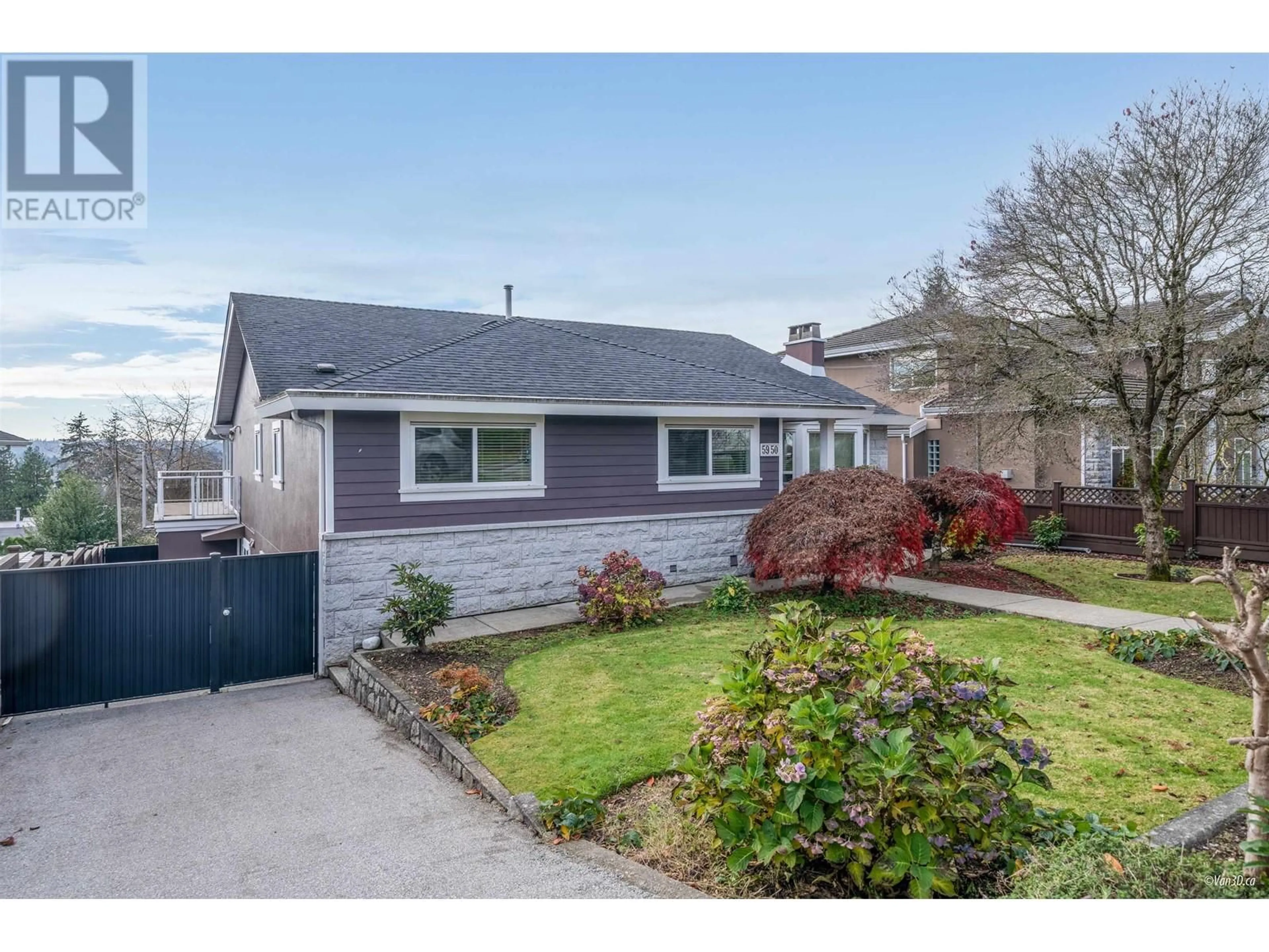 Frontside or backside of a home, the fenced backyard for 5950 KITCHENER STREET, Burnaby British Columbia V5B2J2