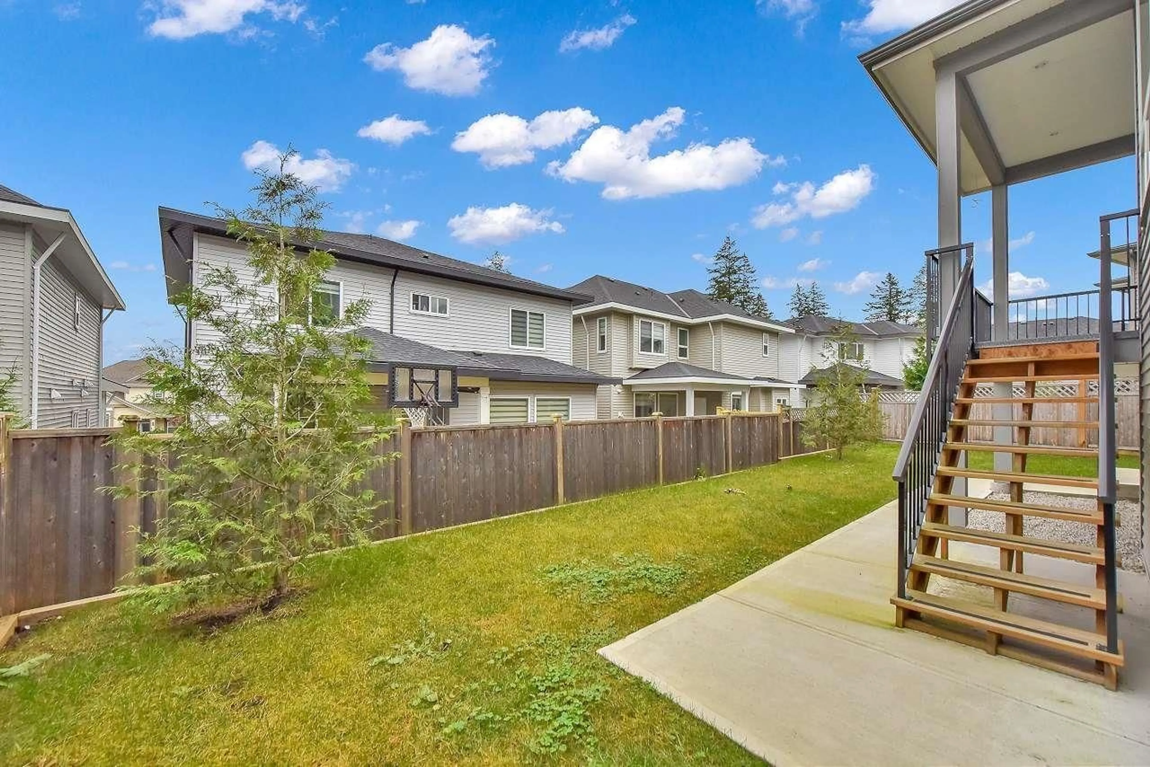 A pic from exterior of the house or condo, the fenced backyard for 14285 61B AVENUE, Surrey British Columbia V3X0K5