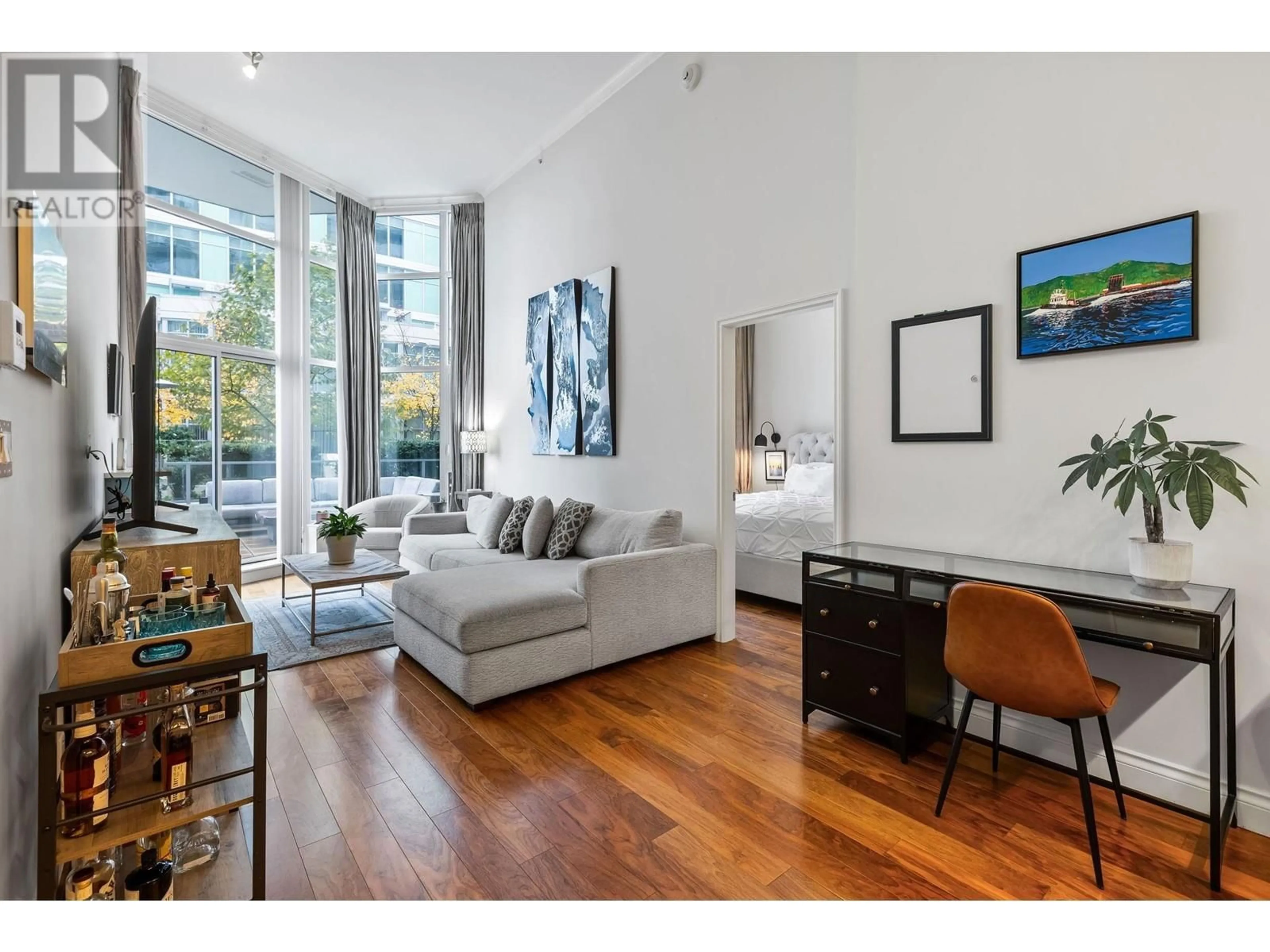 Living room, wood floors for 104 199 VICTORY SHIP WAY, North Vancouver British Columbia V9L0E2