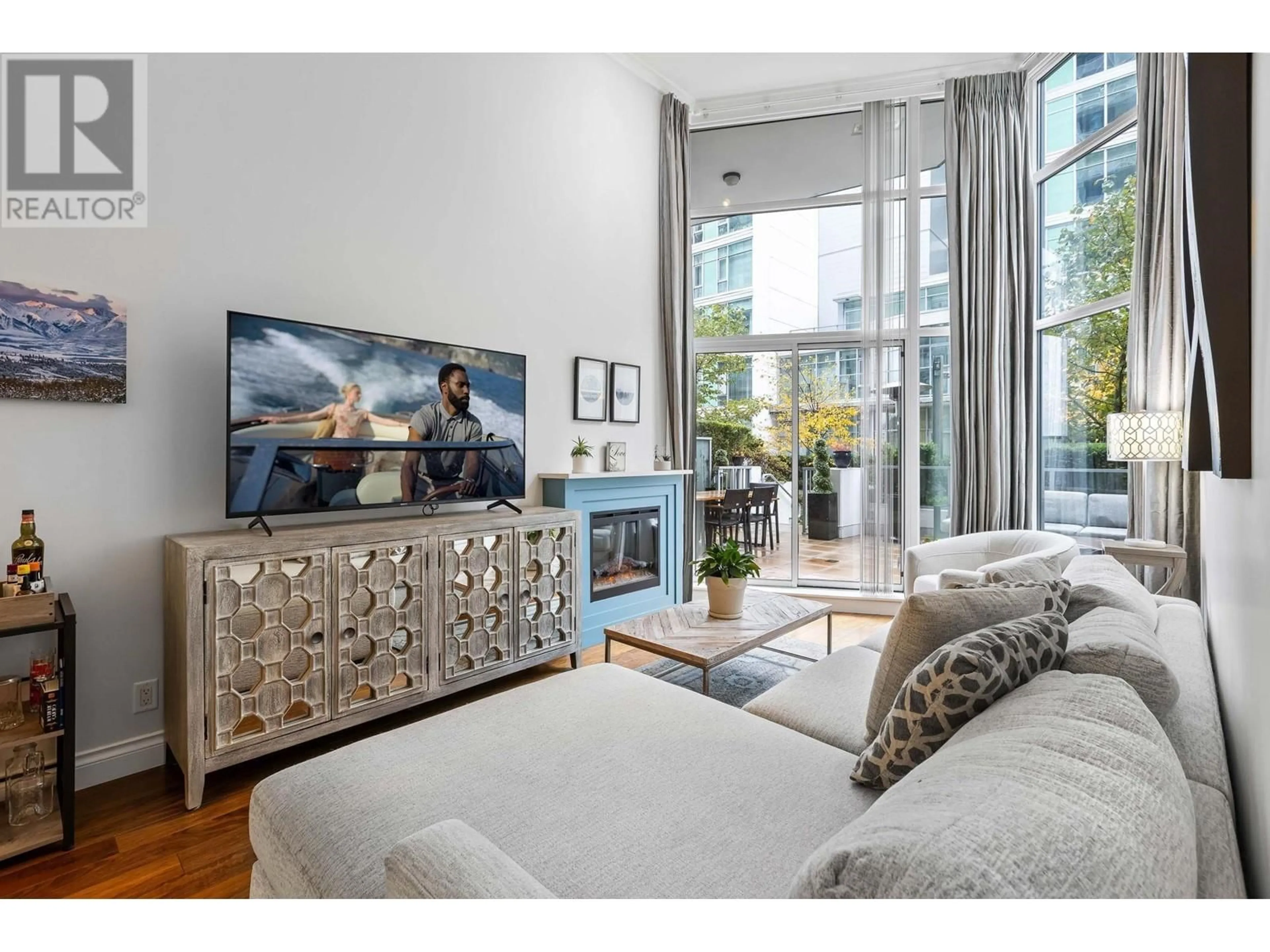 Living room, wood floors for 104 199 VICTORY SHIP WAY, North Vancouver British Columbia V9L0E2