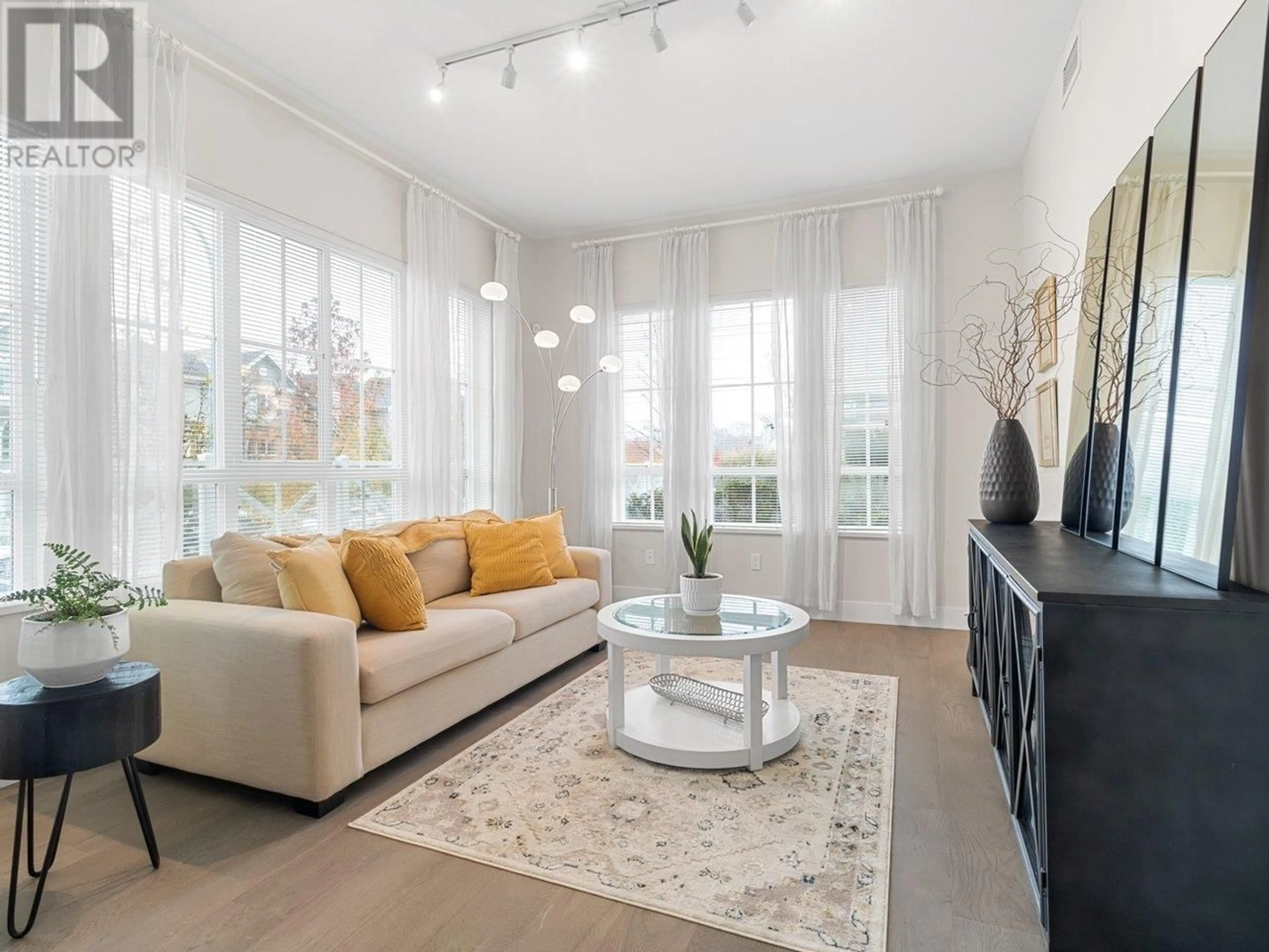 Living room, wood floors for 103 5535 ADMIRAL WAY, Delta British Columbia V4K0E3