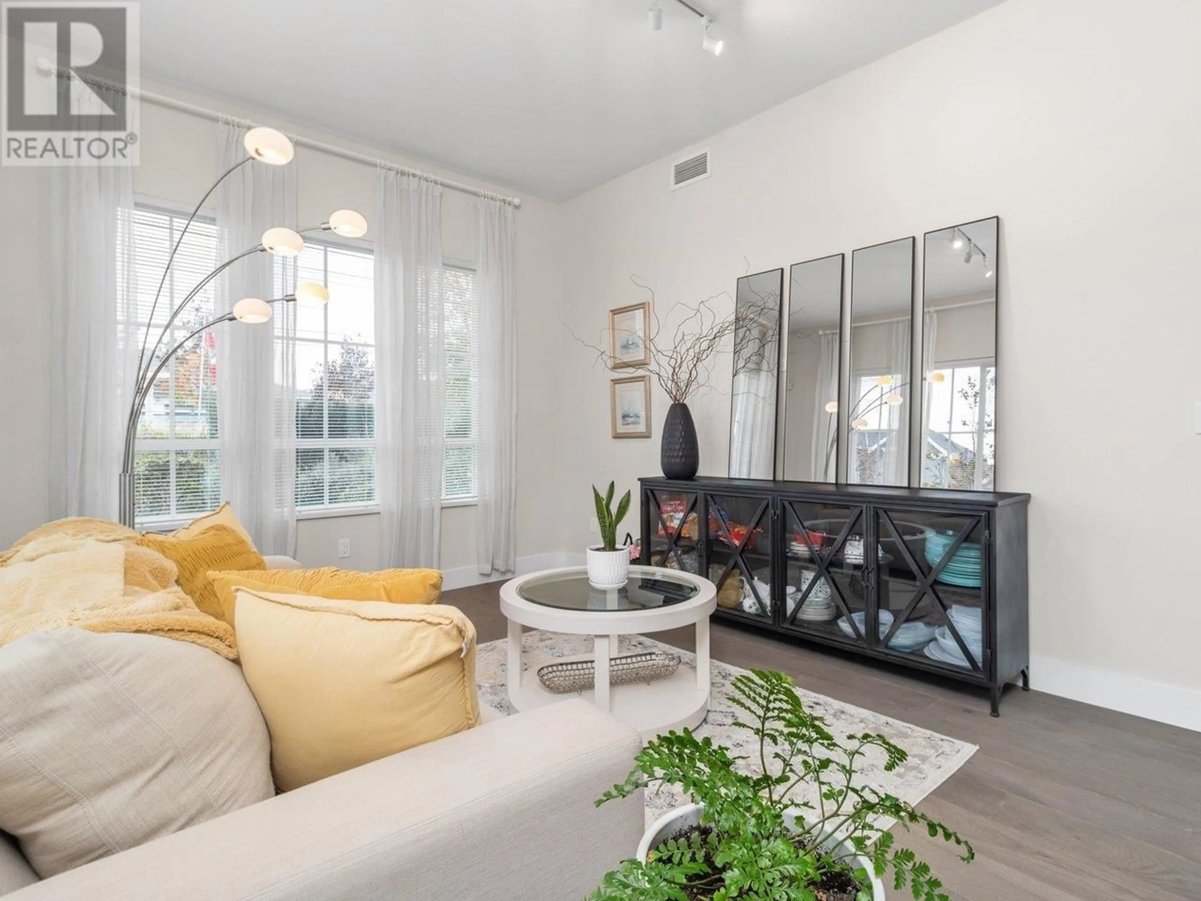 Living room, wood floors for 103 5535 ADMIRAL WAY, Delta British Columbia V4K0E3