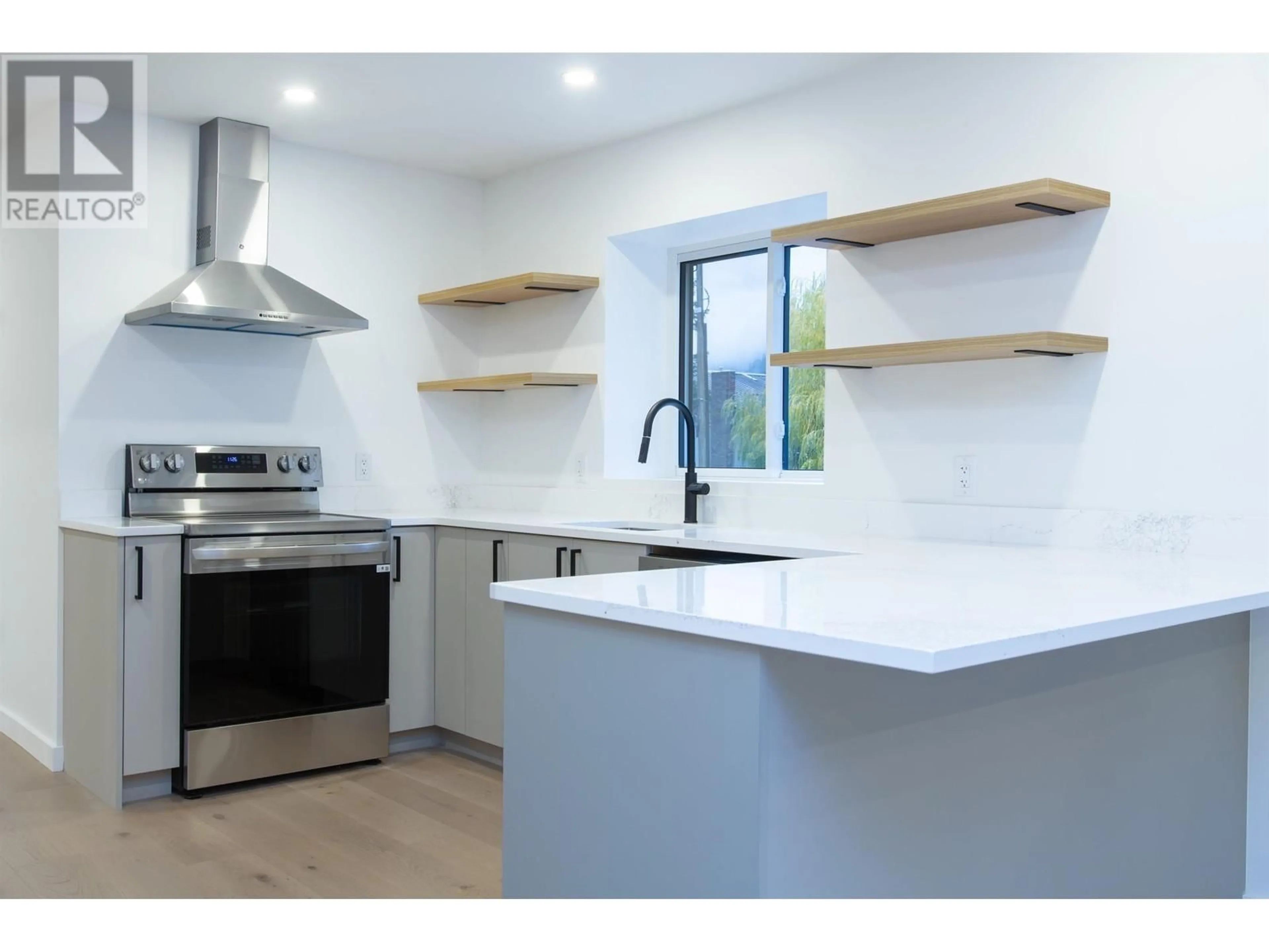 Open concept kitchen for 7388 LAUREL STREET, Pemberton British Columbia V0N2L0