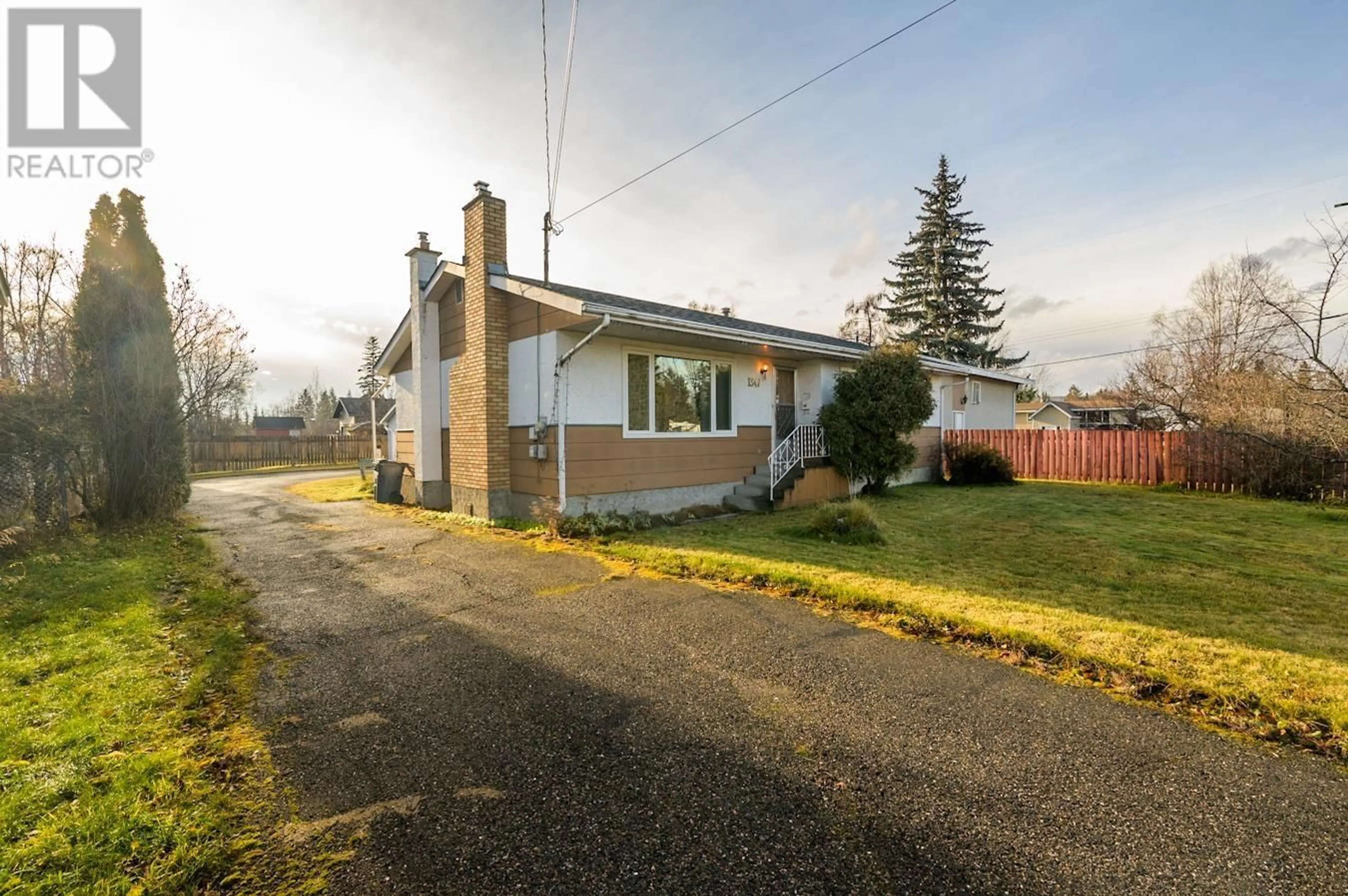 A pic from exterior of the house or condo, the fenced backyard for 1347 VILLAGE AVENUE, Prince George British Columbia V2L4L5