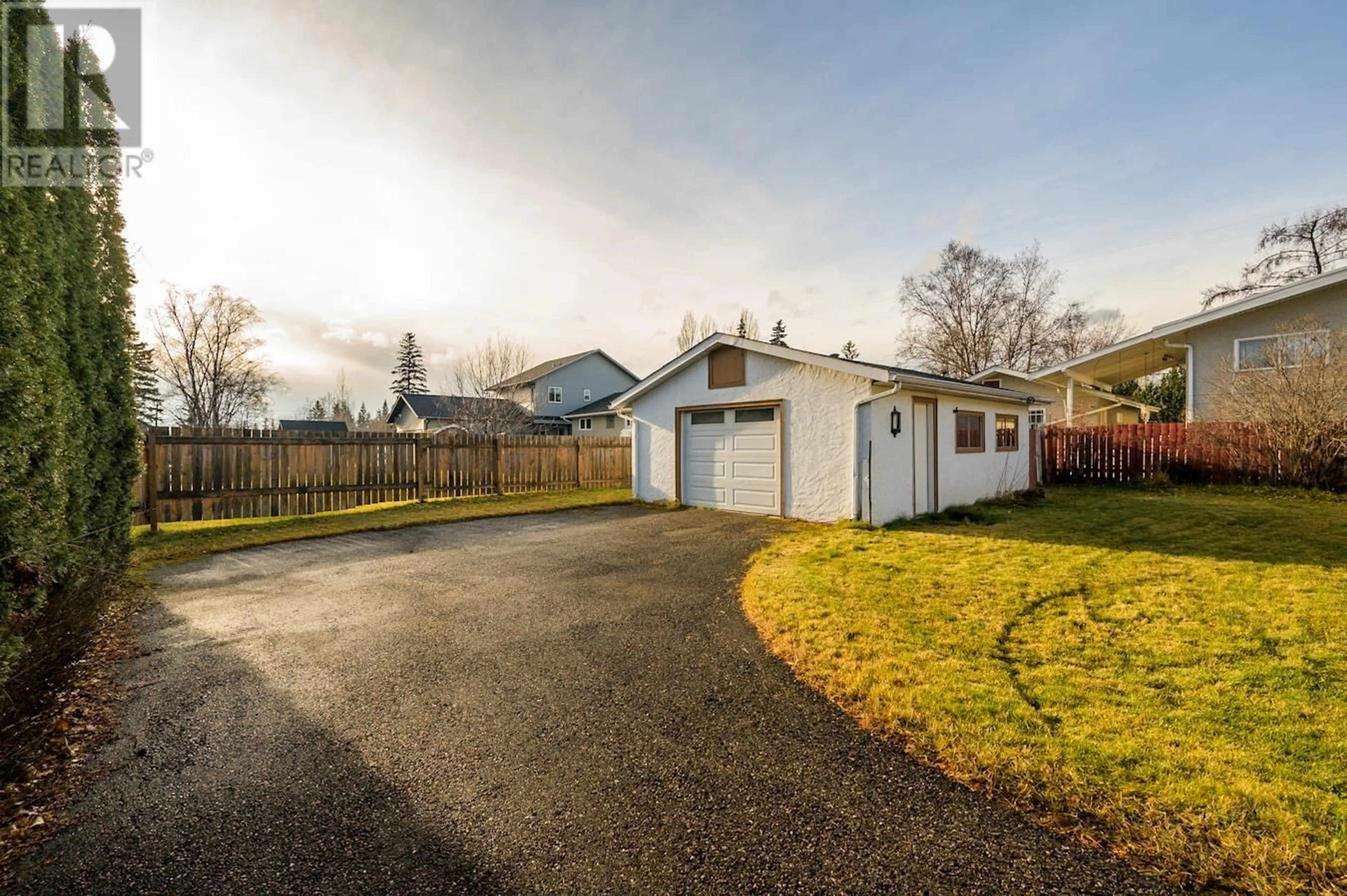 Frontside or backside of a home, the fenced backyard for 1347 VILLAGE AVENUE, Prince George British Columbia V2L4L5