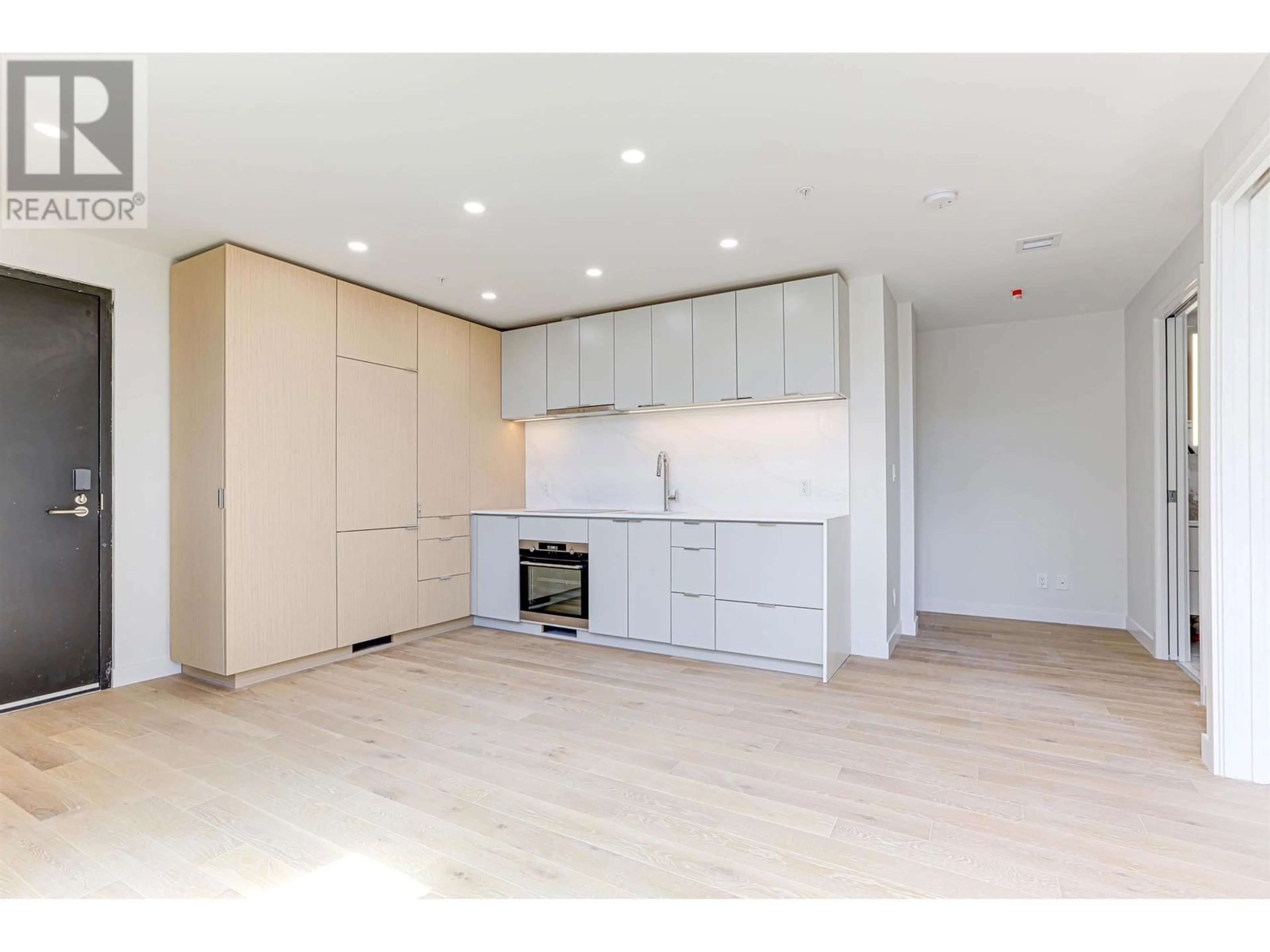 Open concept kitchen, wood/laminate floor for 606 - 239 KEEFER STREET, Vancouver British Columbia V6A1X6