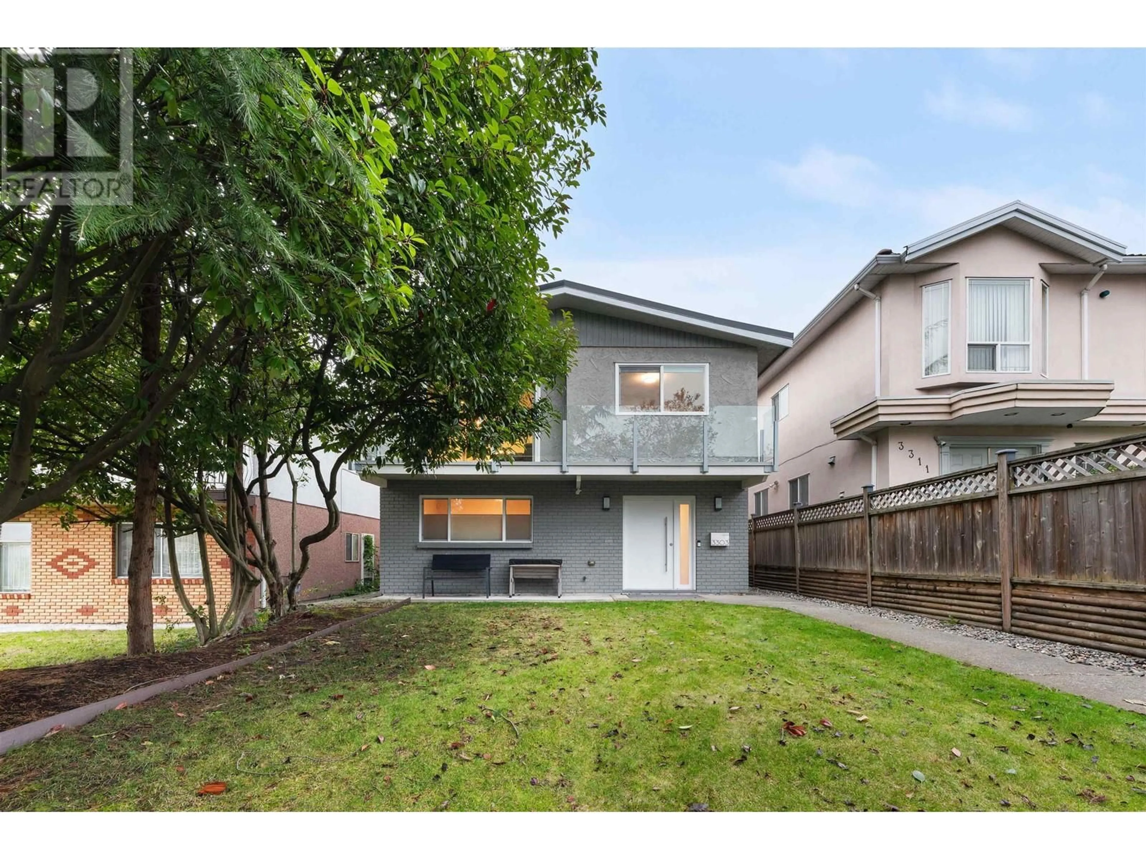 Frontside or backside of a home, the fenced backyard for 3303 VENABLES STREET, Vancouver British Columbia V5K2S7