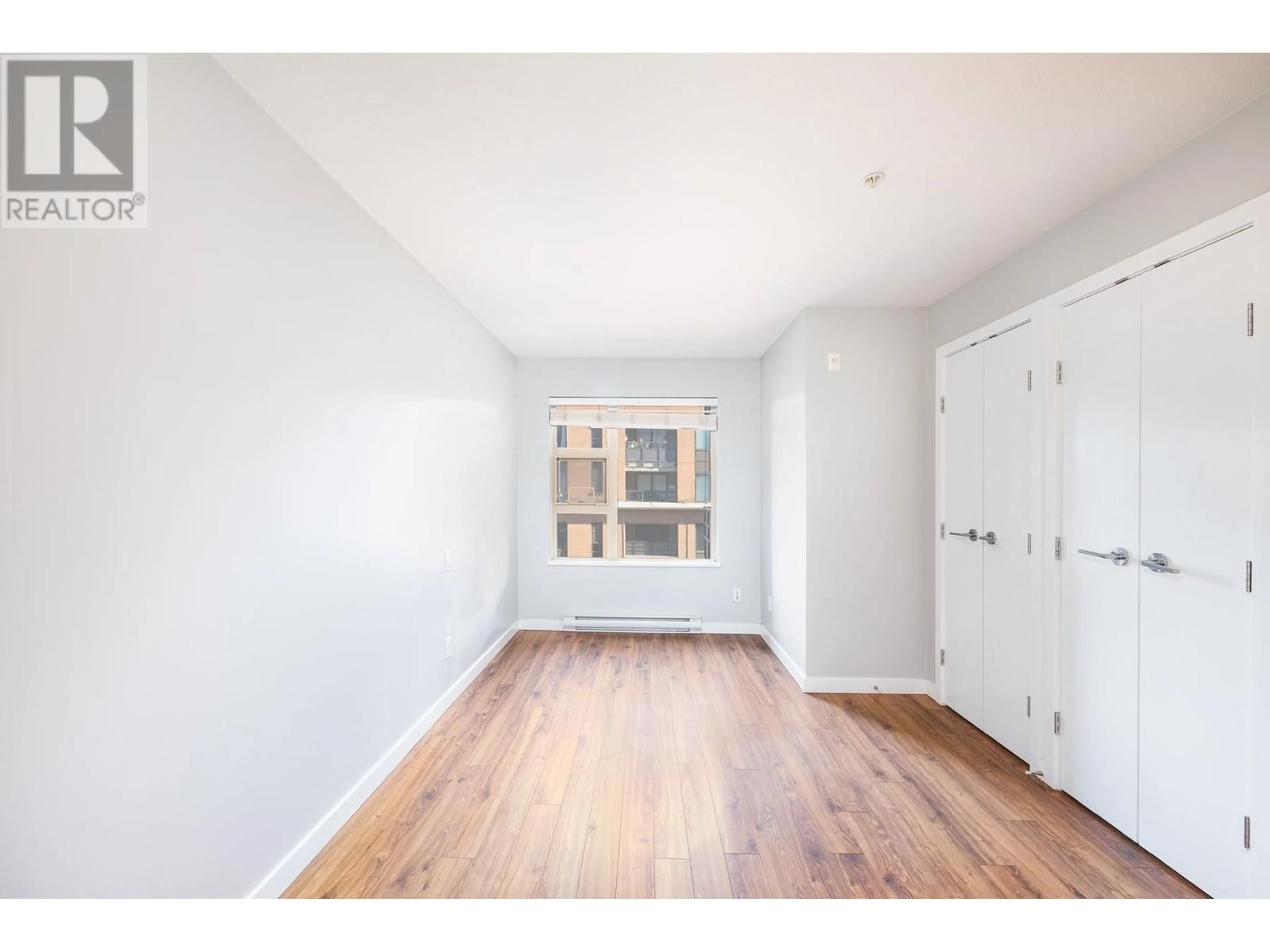 A pic of a room, wood floors for 310 1679 LLOYD AVENUE, North Vancouver British Columbia V7P0A9