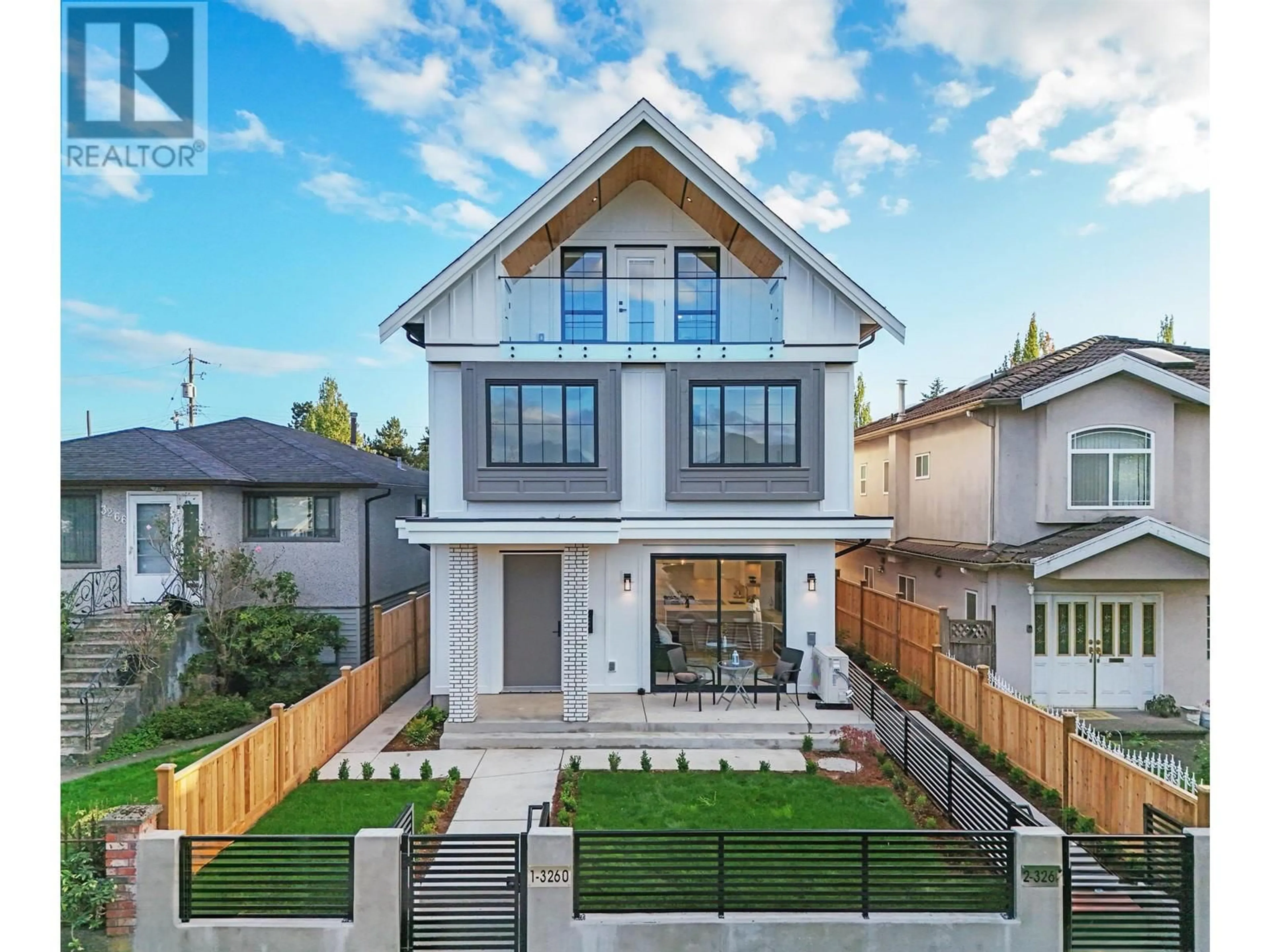 Frontside or backside of a home, the fenced backyard for 2 3260 GRAVELEY STREET, Vancouver British Columbia V5K3K9