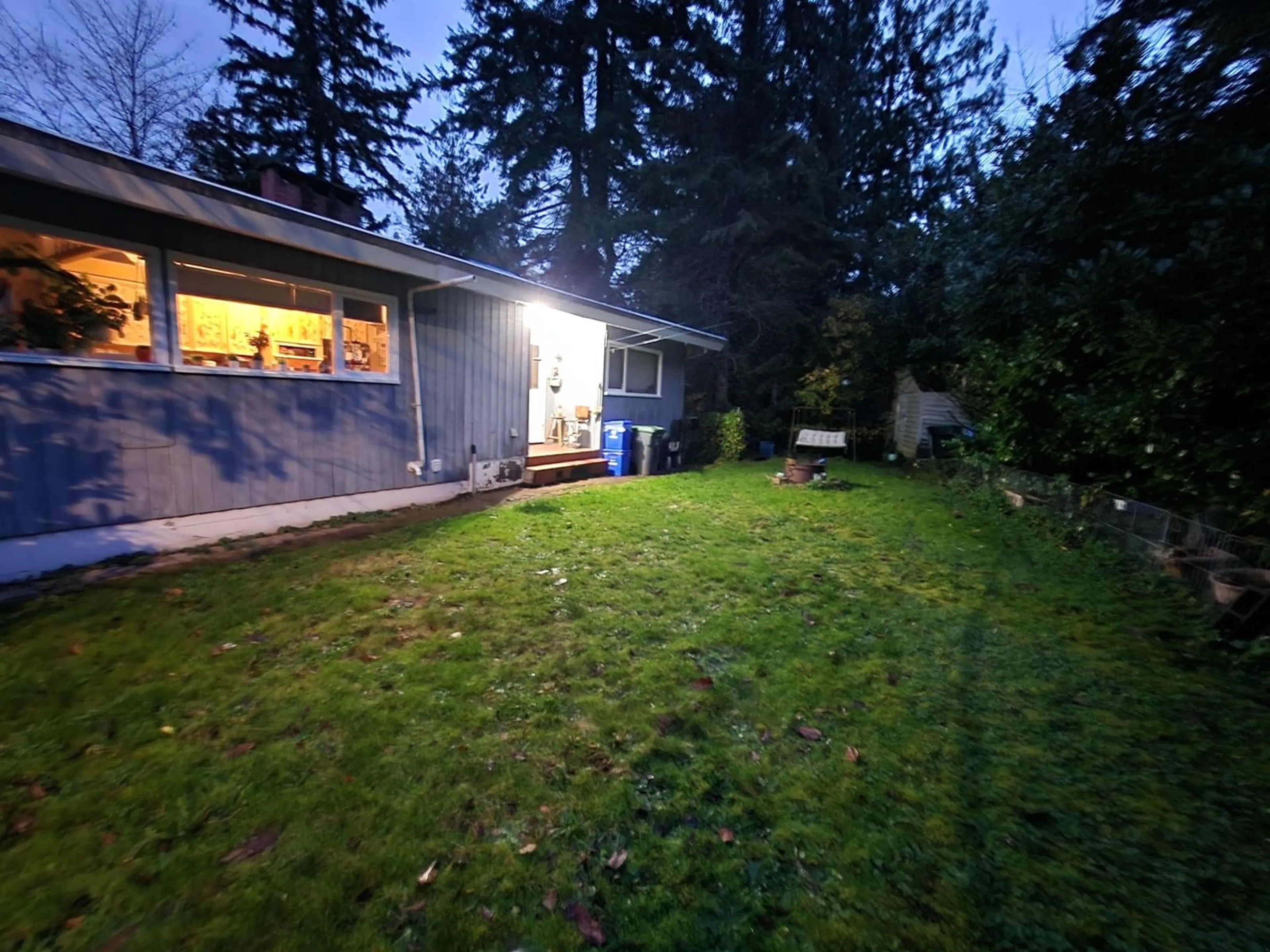 A pic from exterior of the house or condo, the fenced backyard for 12214 101A AVENUE, Surrey British Columbia V3V3A2