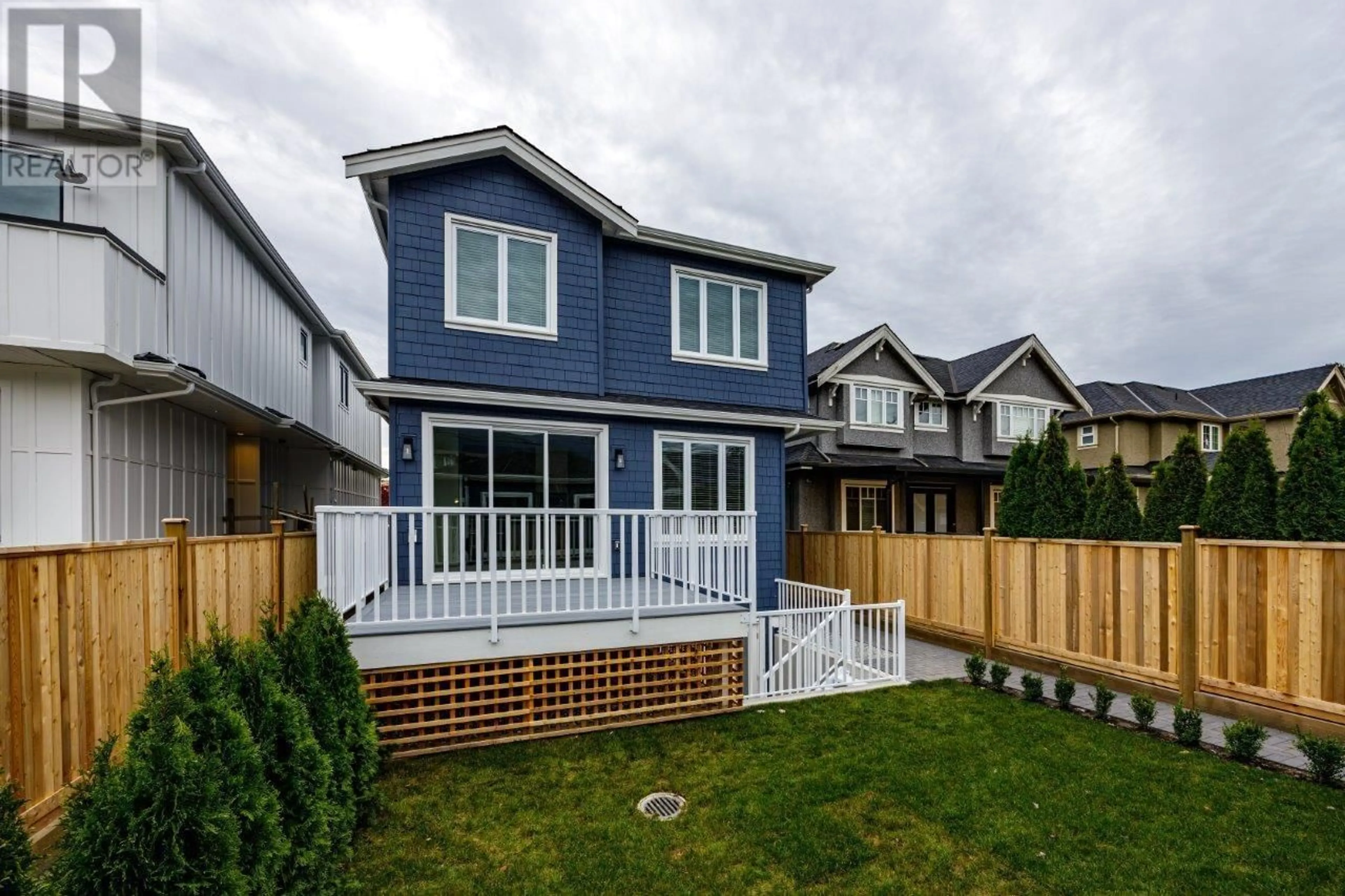 Frontside or backside of a home, the fenced backyard for 336 E 17TH STREET, North Vancouver British Columbia V7L2V9