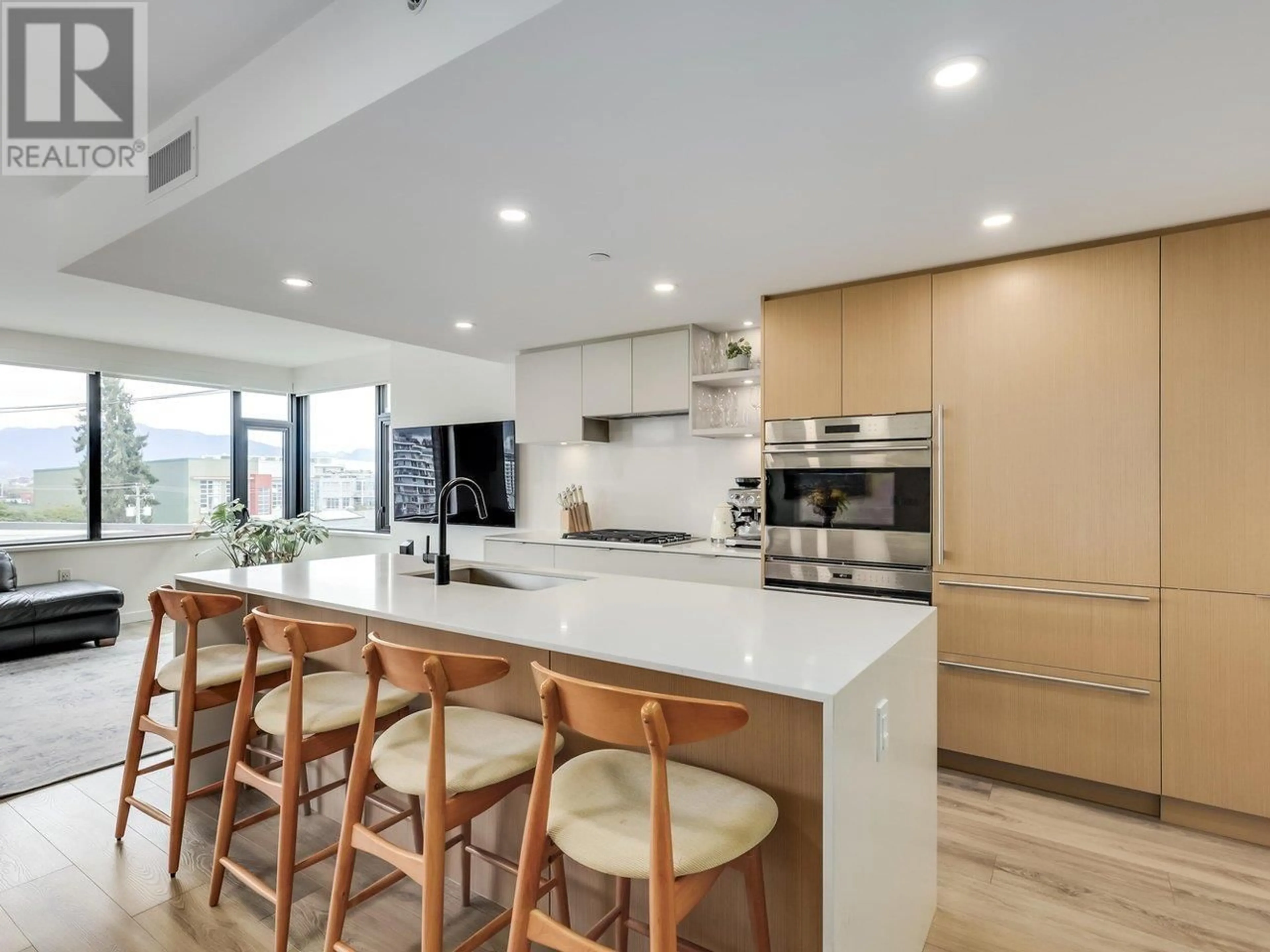 Contemporary kitchen, wood floors for 409 210 E 5TH AVENUE, Vancouver British Columbia V5T0K1