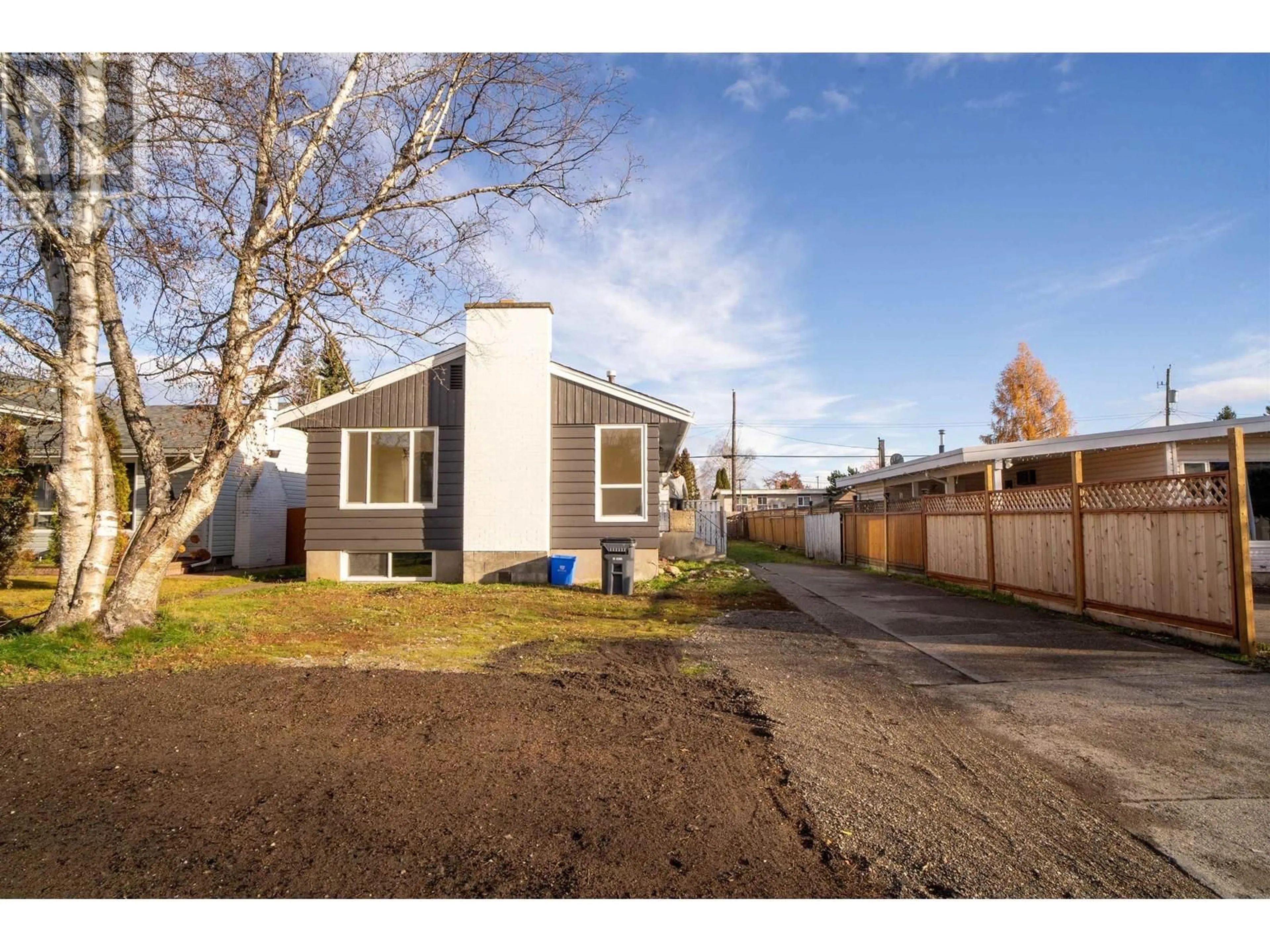 Frontside or backside of a home, the fenced backyard for 242 S LYON STREET, Prince George British Columbia V2M3K8