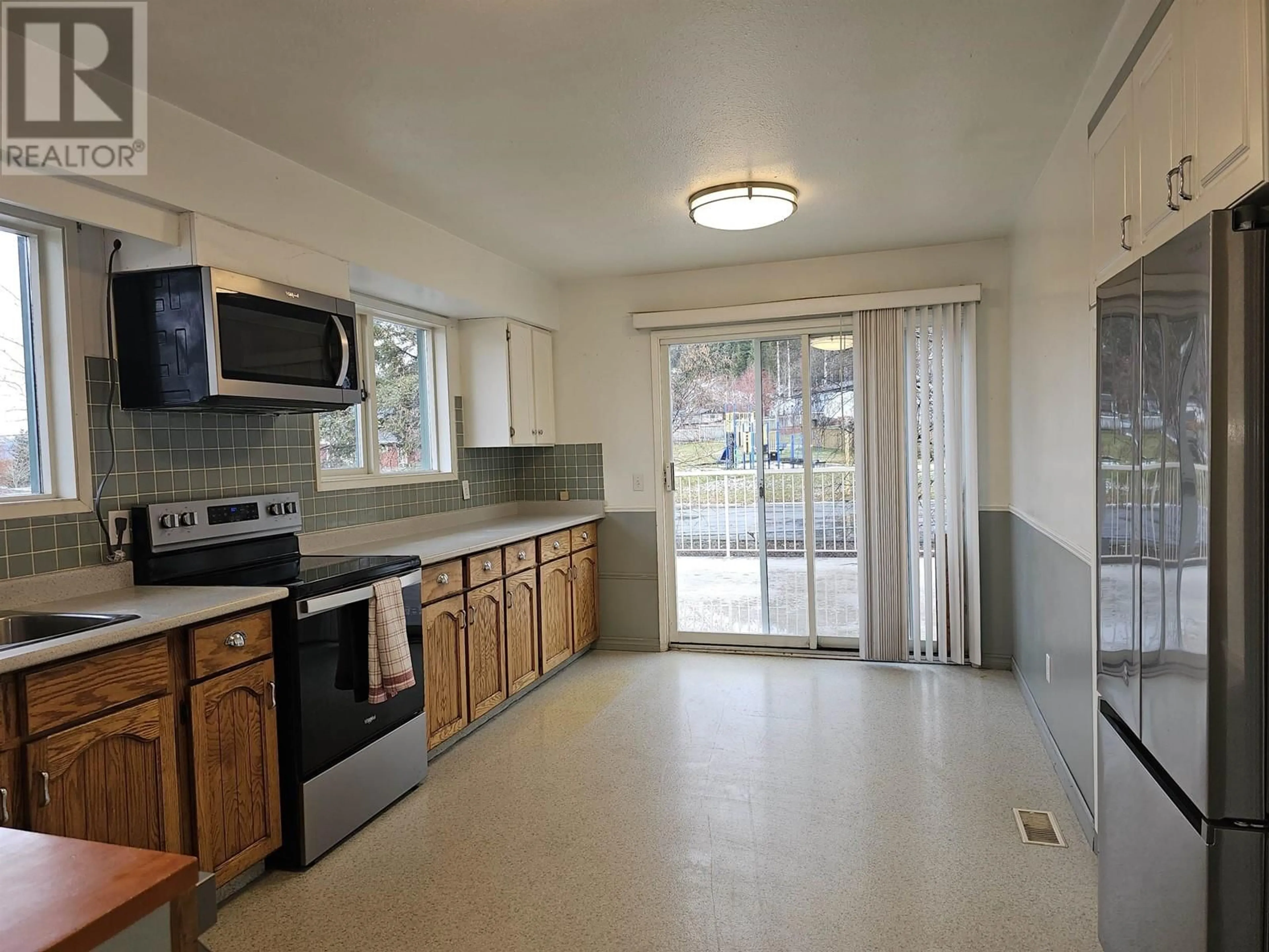 Standard kitchen, wood floors for 488 SIMON FRASER AVENUE, Fraser Lake British Columbia V0J1S0