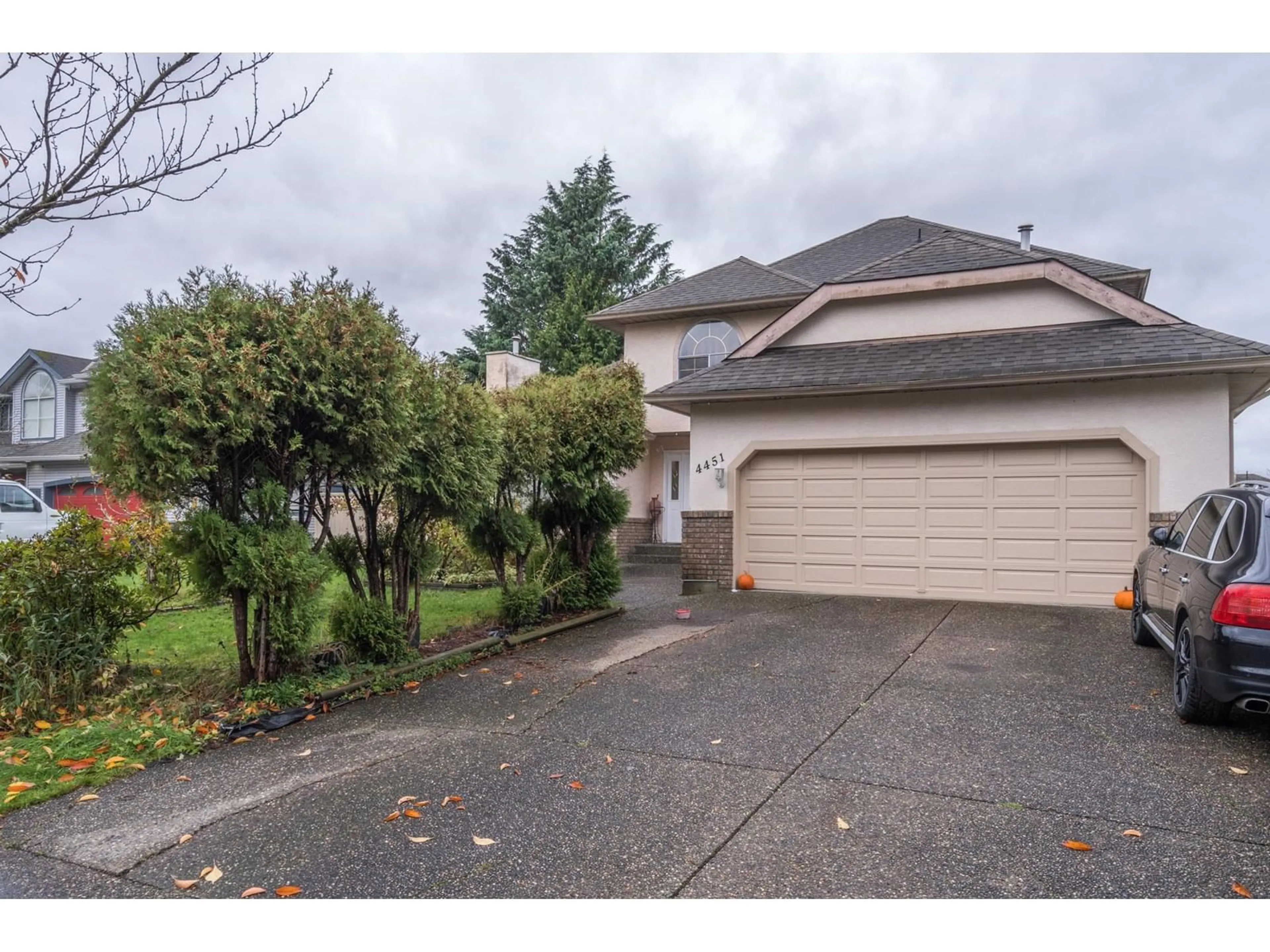 Frontside or backside of a home, the street view for 4451 224 STREET, Langley British Columbia V2Z1A8