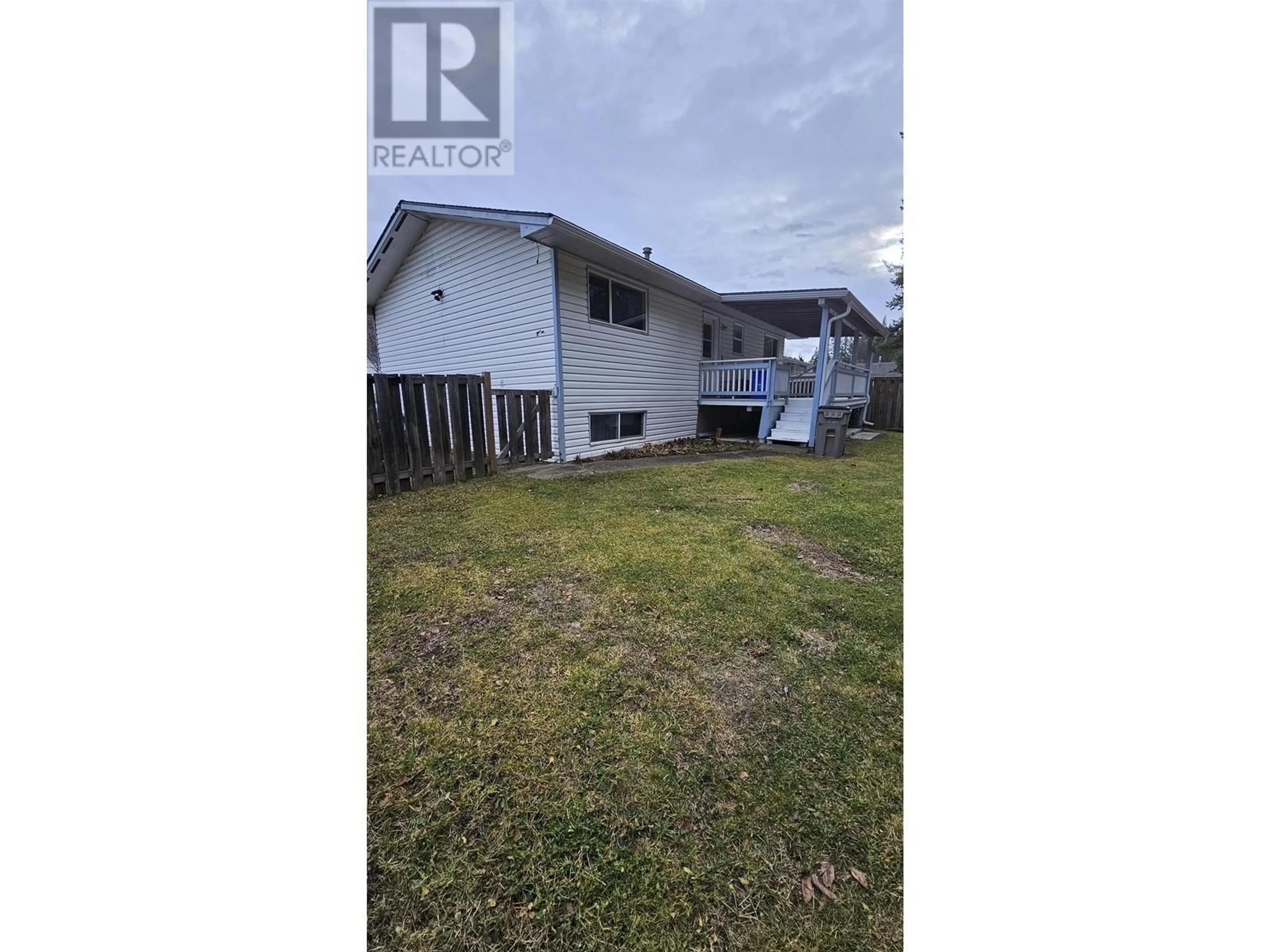 Frontside or backside of a home, the fenced backyard for 699 HEALY STREET, Quesnel British Columbia V2J4V1