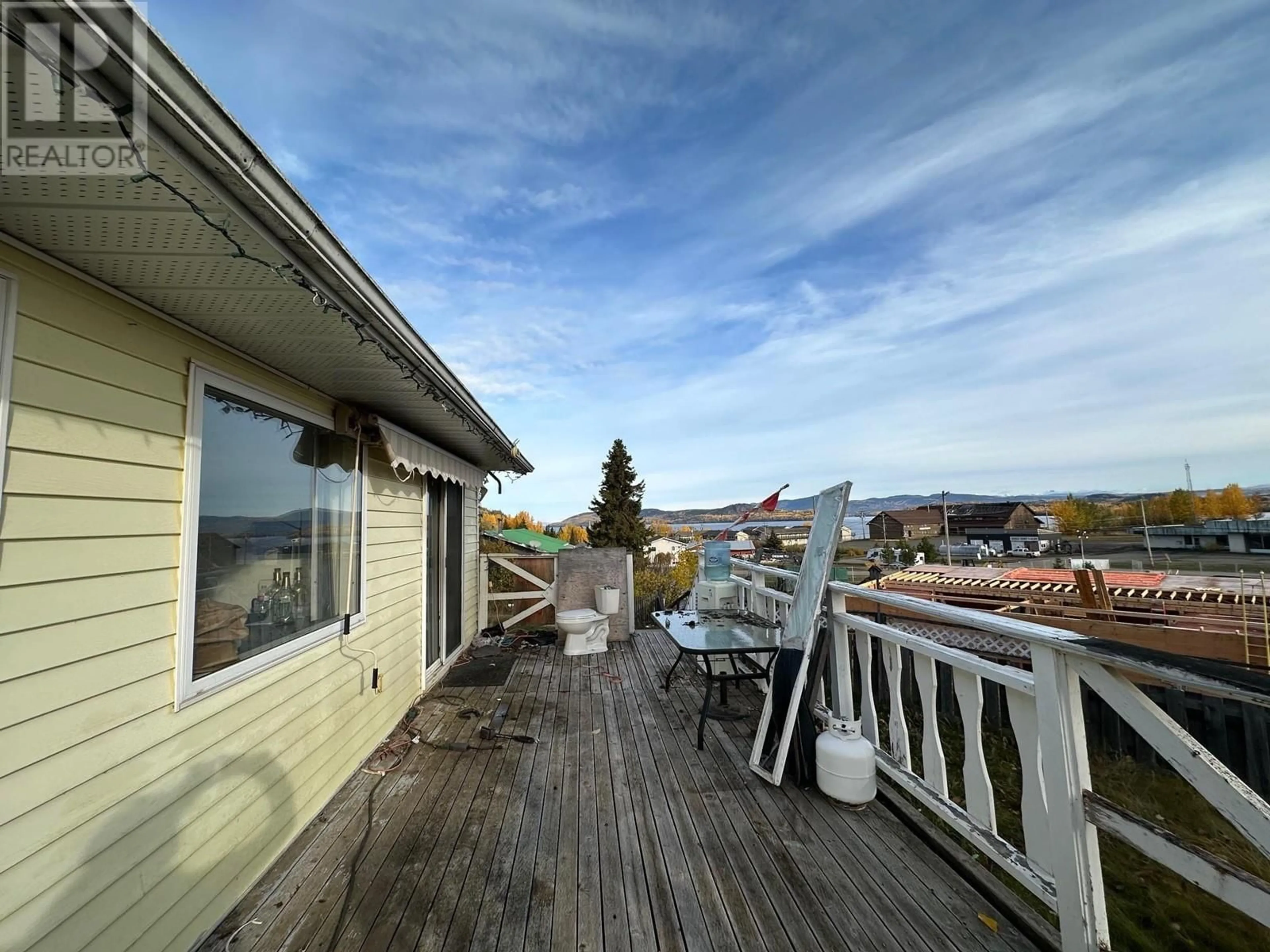 A pic from exterior of the house or condo, the fenced backyard for 6 MCDONALD AVENUE, Granisle British Columbia V0J1W0