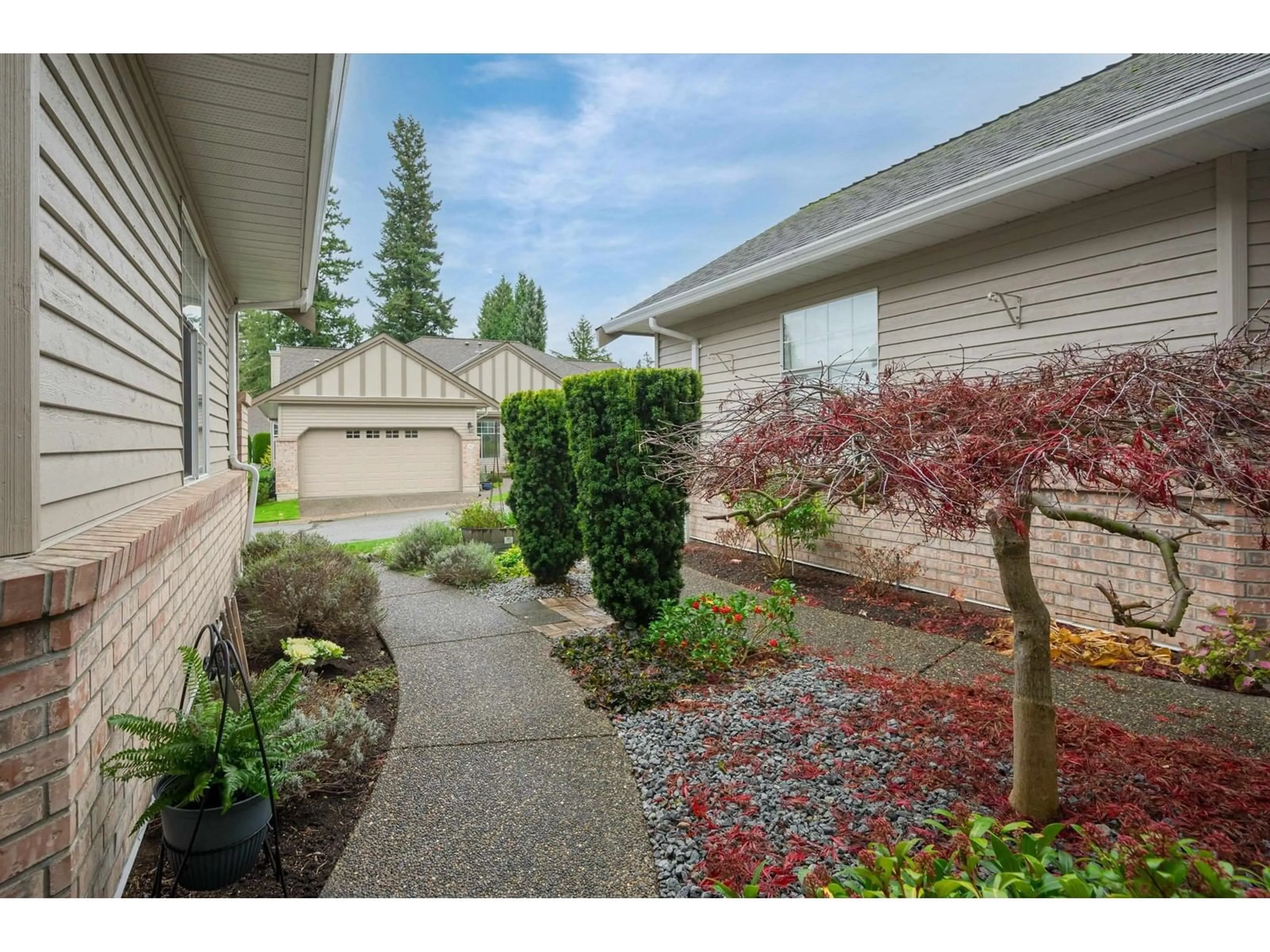 A pic from exterior of the house or condo, the fenced backyard for 113 2533 152 STREET, Surrey British Columbia V4P1N4