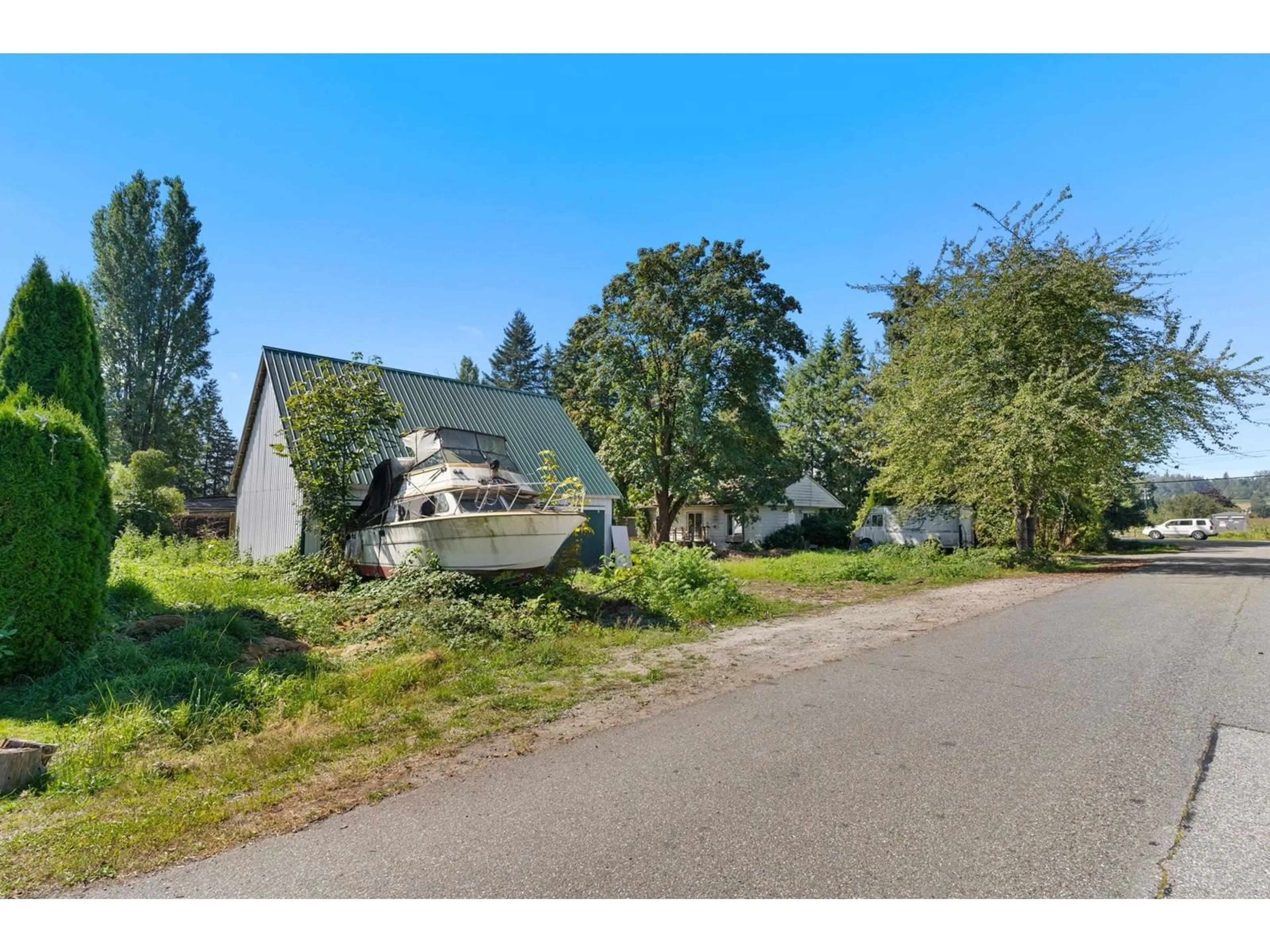 Frontside or backside of a home, the street view for 6934 GLOVER ROAD, Langley British Columbia V2Y1X9