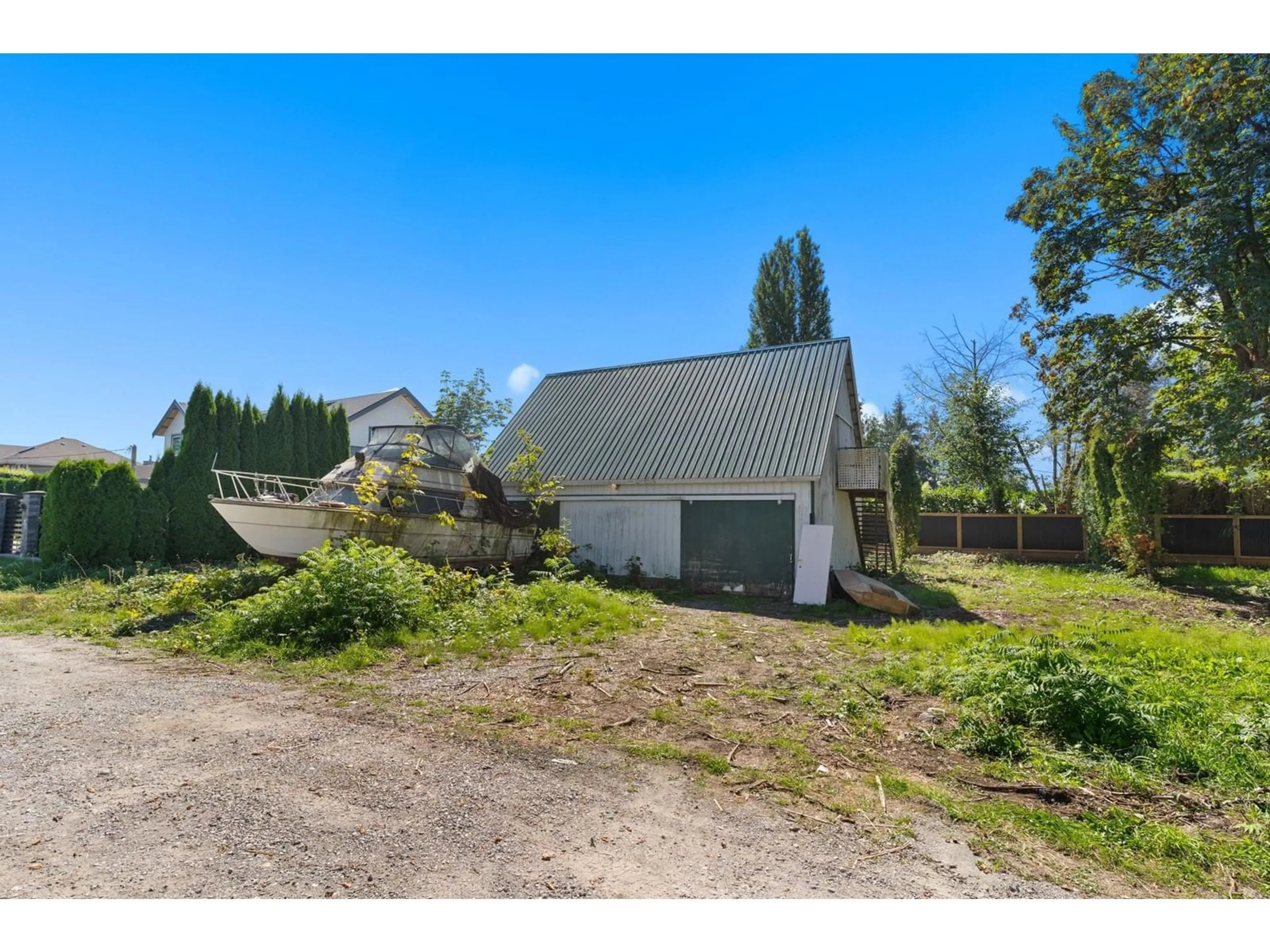 Frontside or backside of a home, the fenced backyard for 6934 GLOVER ROAD, Langley British Columbia V2Y1X9