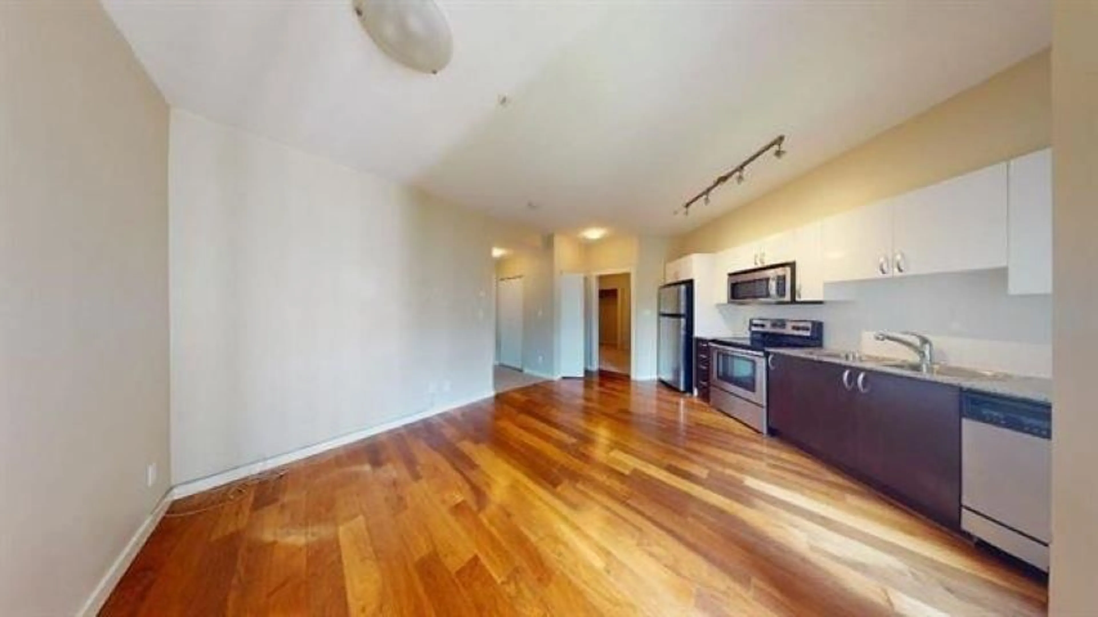 A pic of a room, wood floors for 318 13728 108 AVENUE, Surrey British Columbia V3T0G2