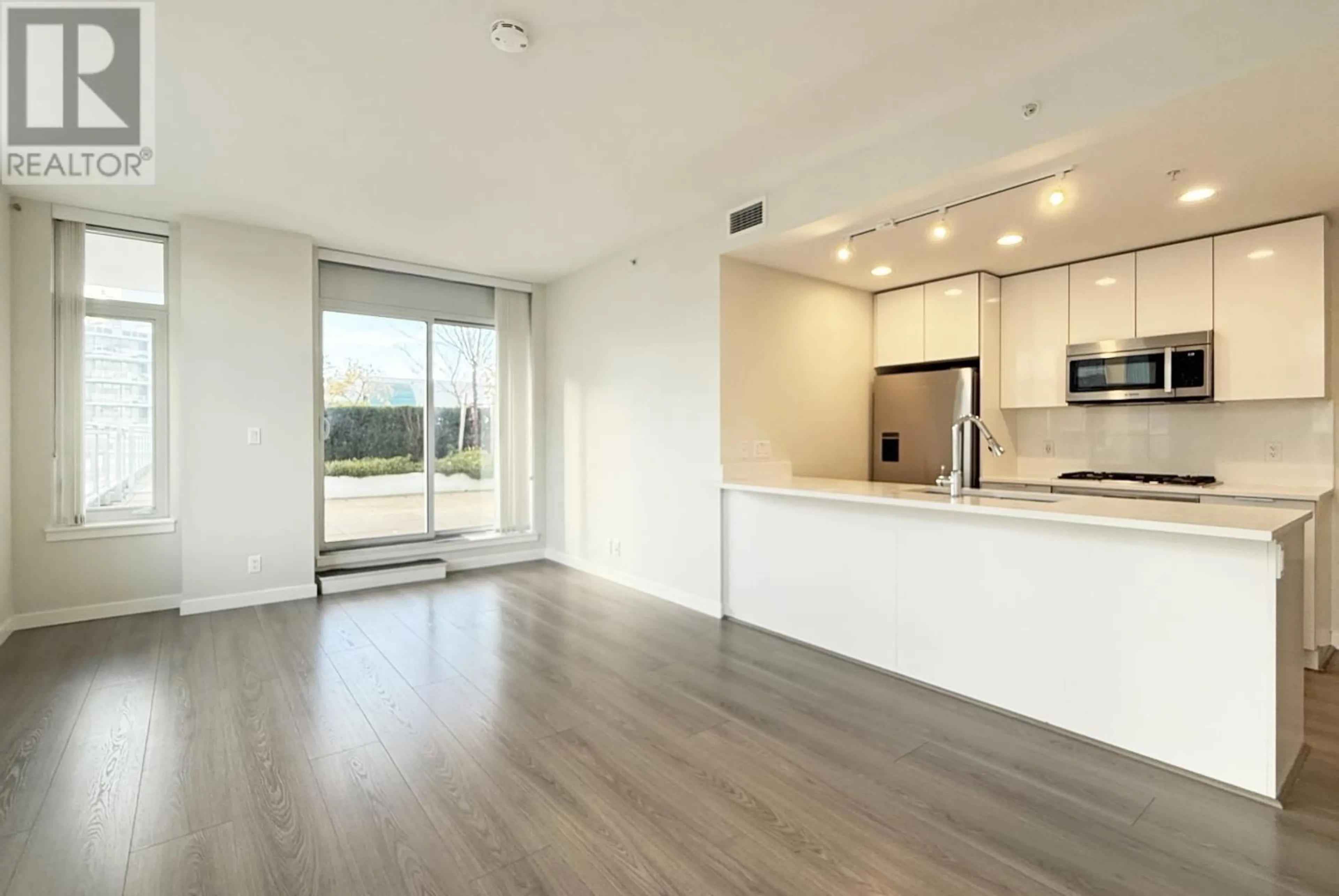 A pic of a room, wood floors for 1011 8699 HAZELBRIDGE WAY, Richmond British Columbia V6X0T4