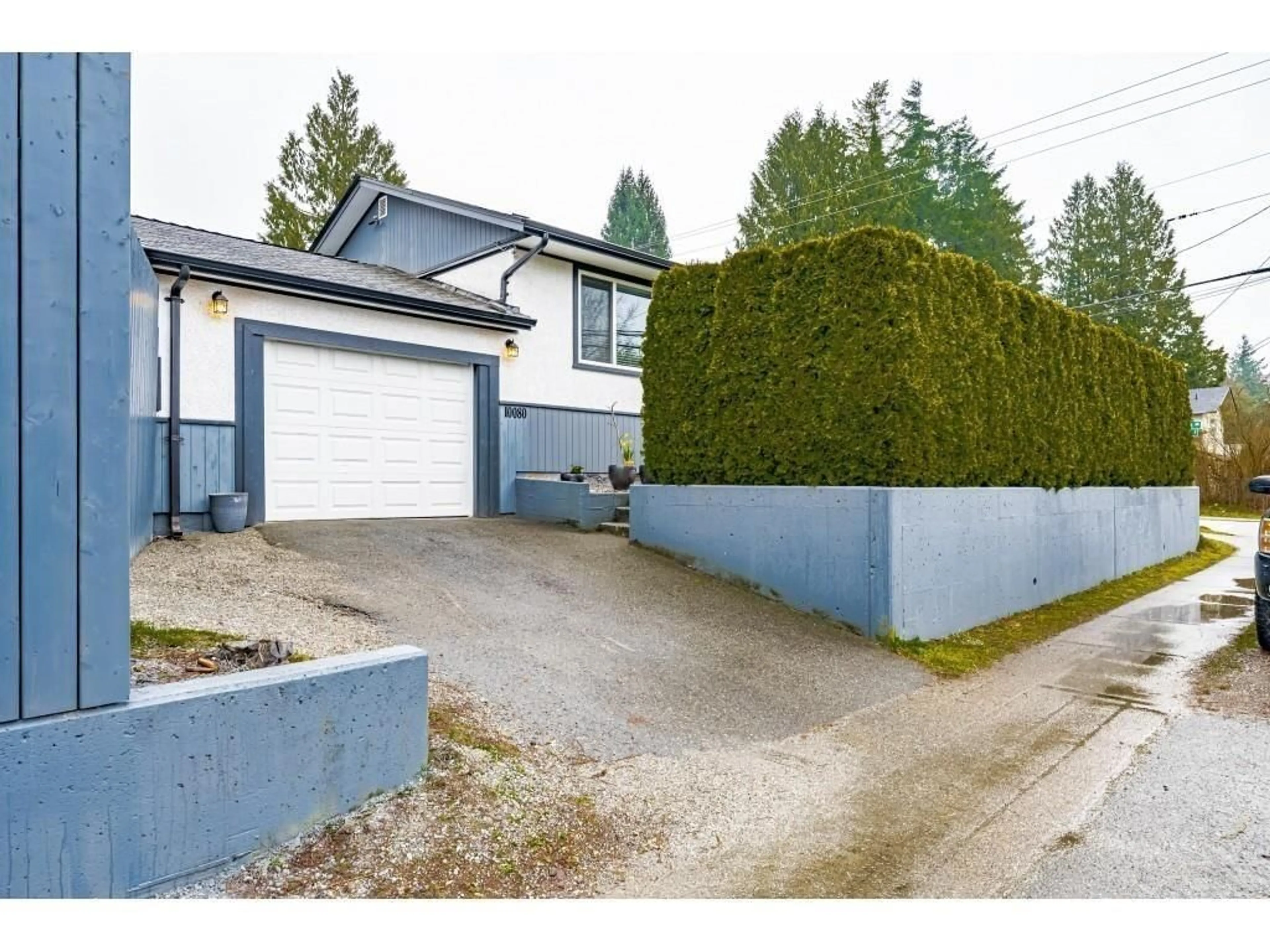 Frontside or backside of a home, the fenced backyard for 10080 140 STREET, Surrey British Columbia V3T4M9