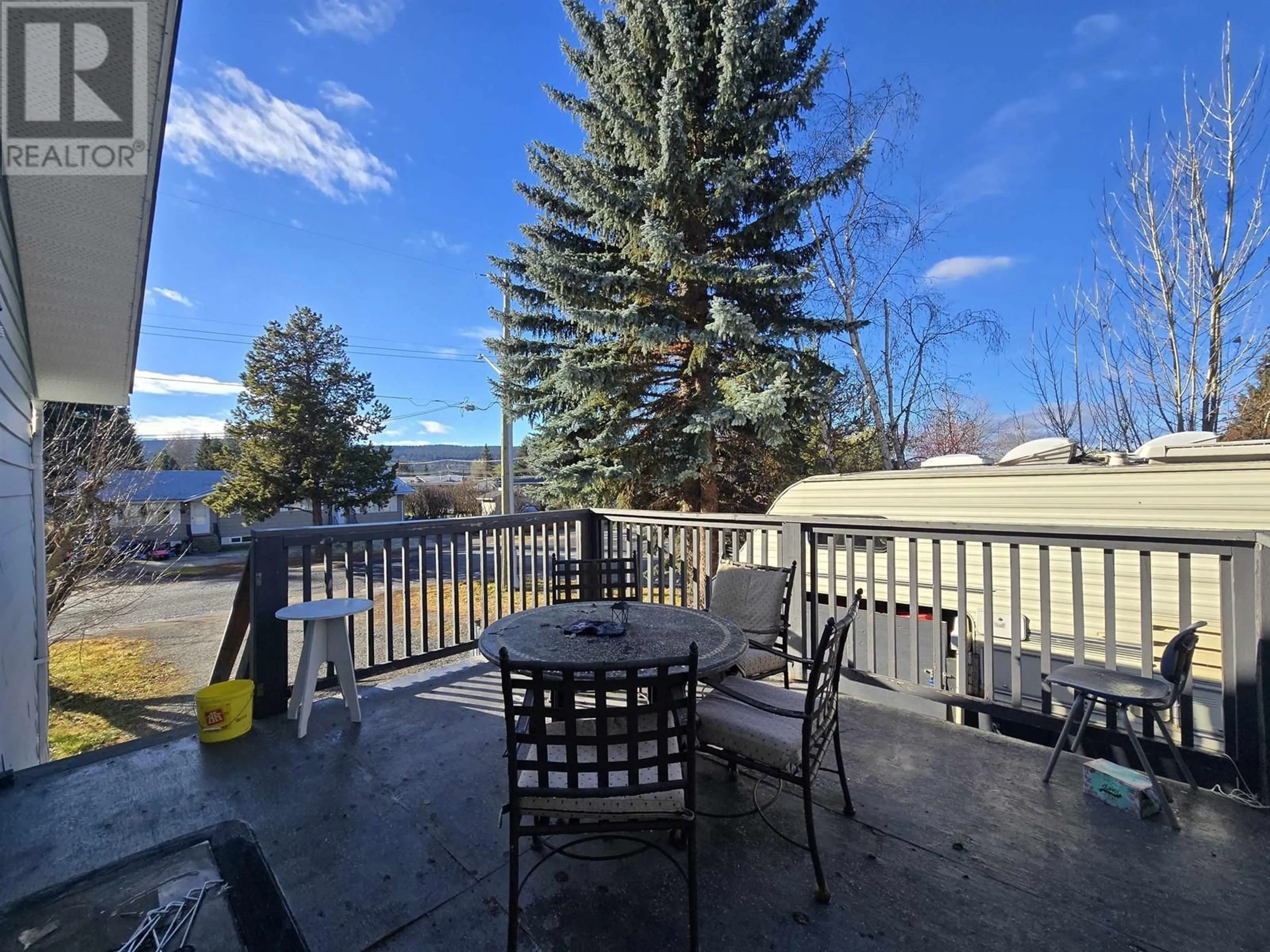 Patio, the fenced backyard for 430 ASPEN STREET, 100 Mile House British Columbia V0K2E0