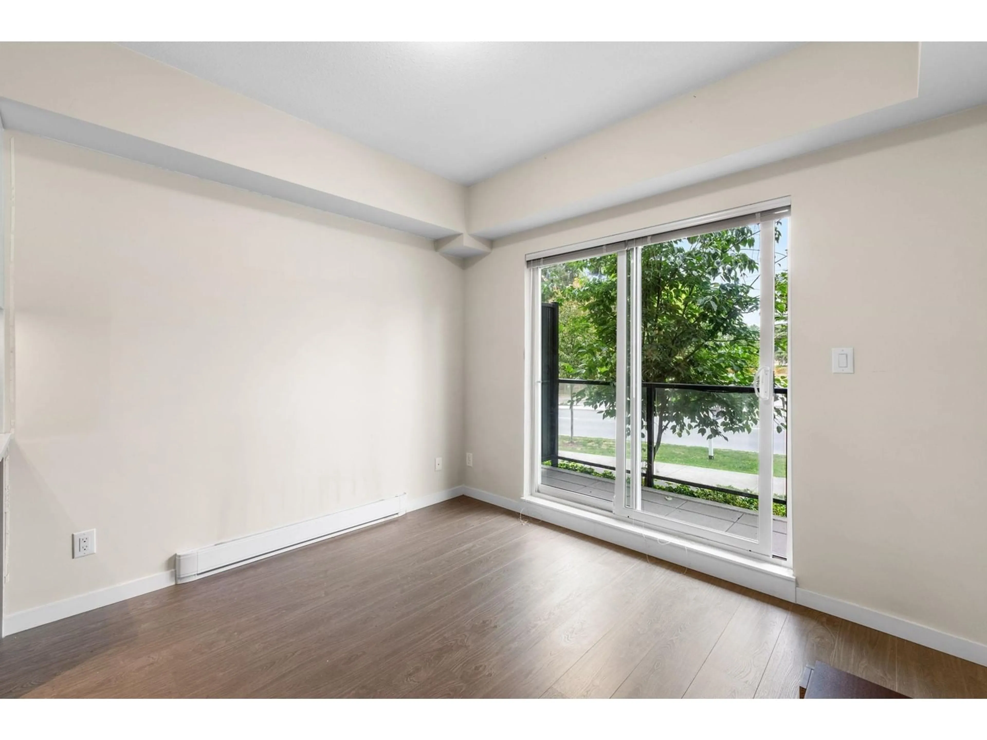 A pic of a room, wood floors for 102 13768 108 AVENUE, Surrey British Columbia V3T0L9