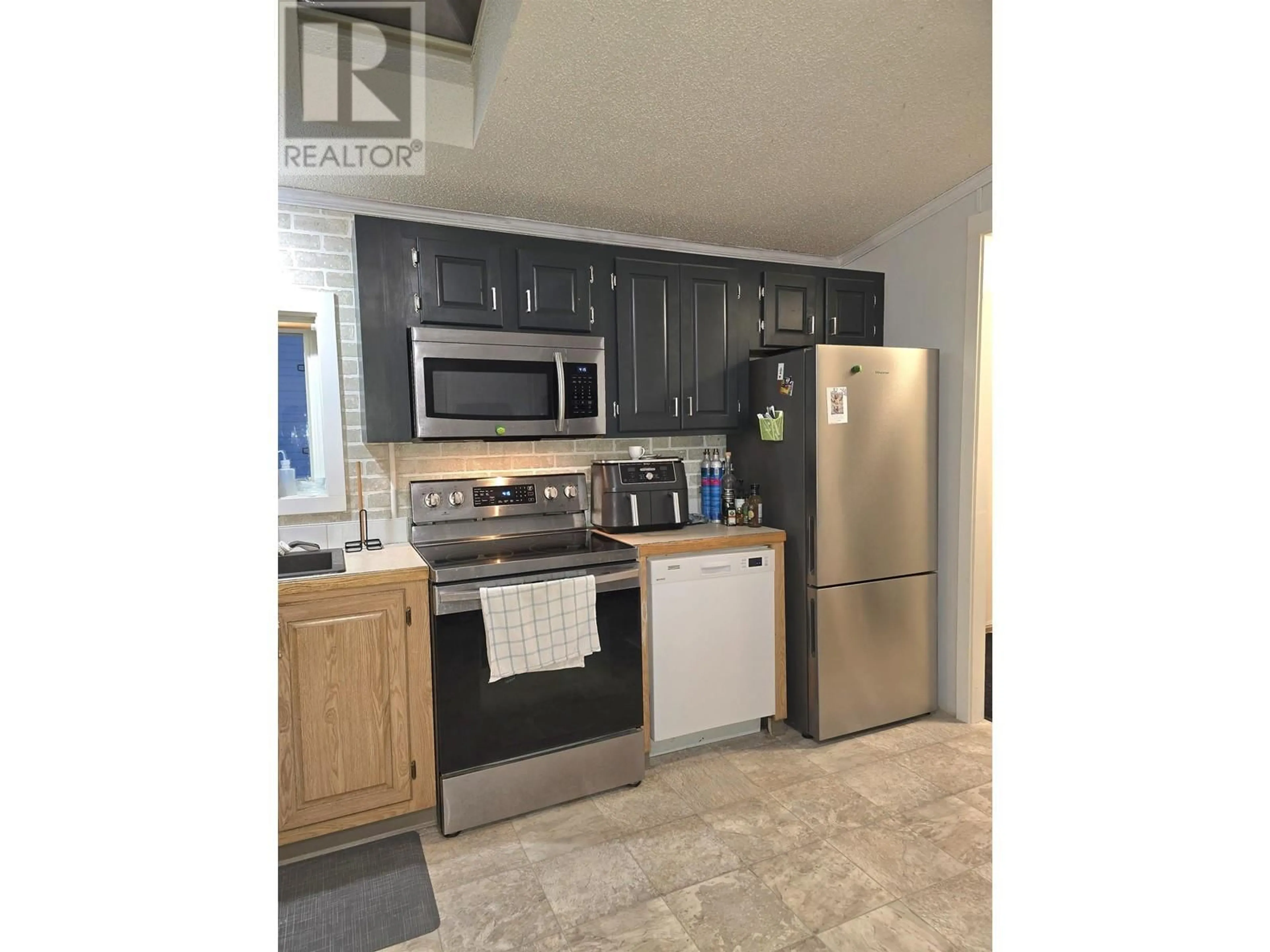 Standard kitchen, cement floor, cottage for 146 2500 GRANT ROAD, Prince George British Columbia V2K4X9