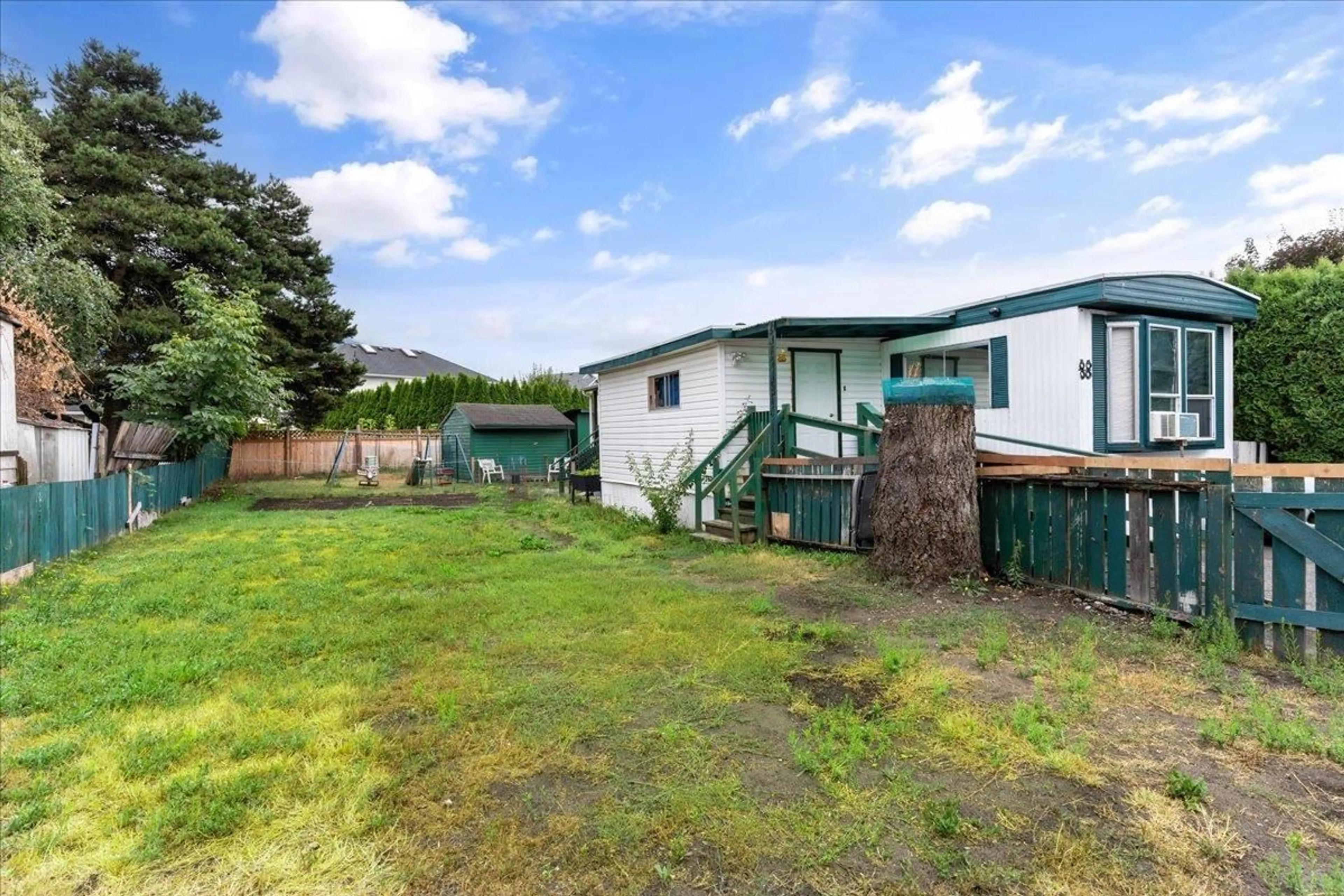 Frontside or backside of a home, the fenced backyard for 88 5742 UNSWORTH ROAD|Sardis South, Chilliwack British Columbia V2R6B4